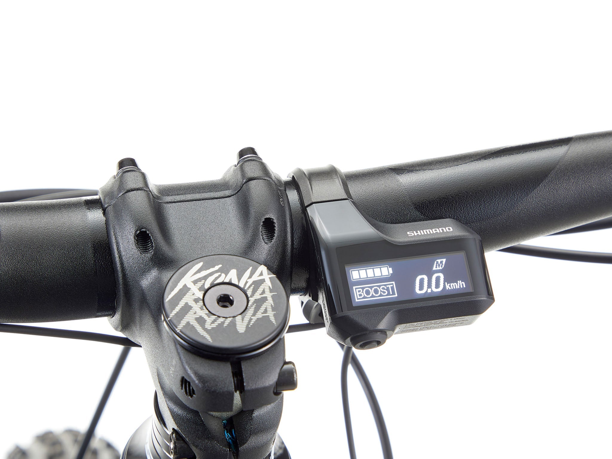 Side view of Kona Remote TrailMaster 140 e-MTB parked on a forest trail, showcasing its rugged frame and Shimano motor.