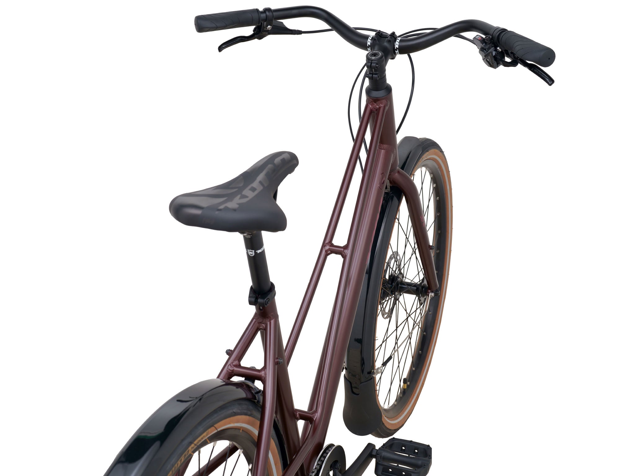 Coco Cruiser step-through bike parked in a sunny urban setting, showcasing its sleek design.