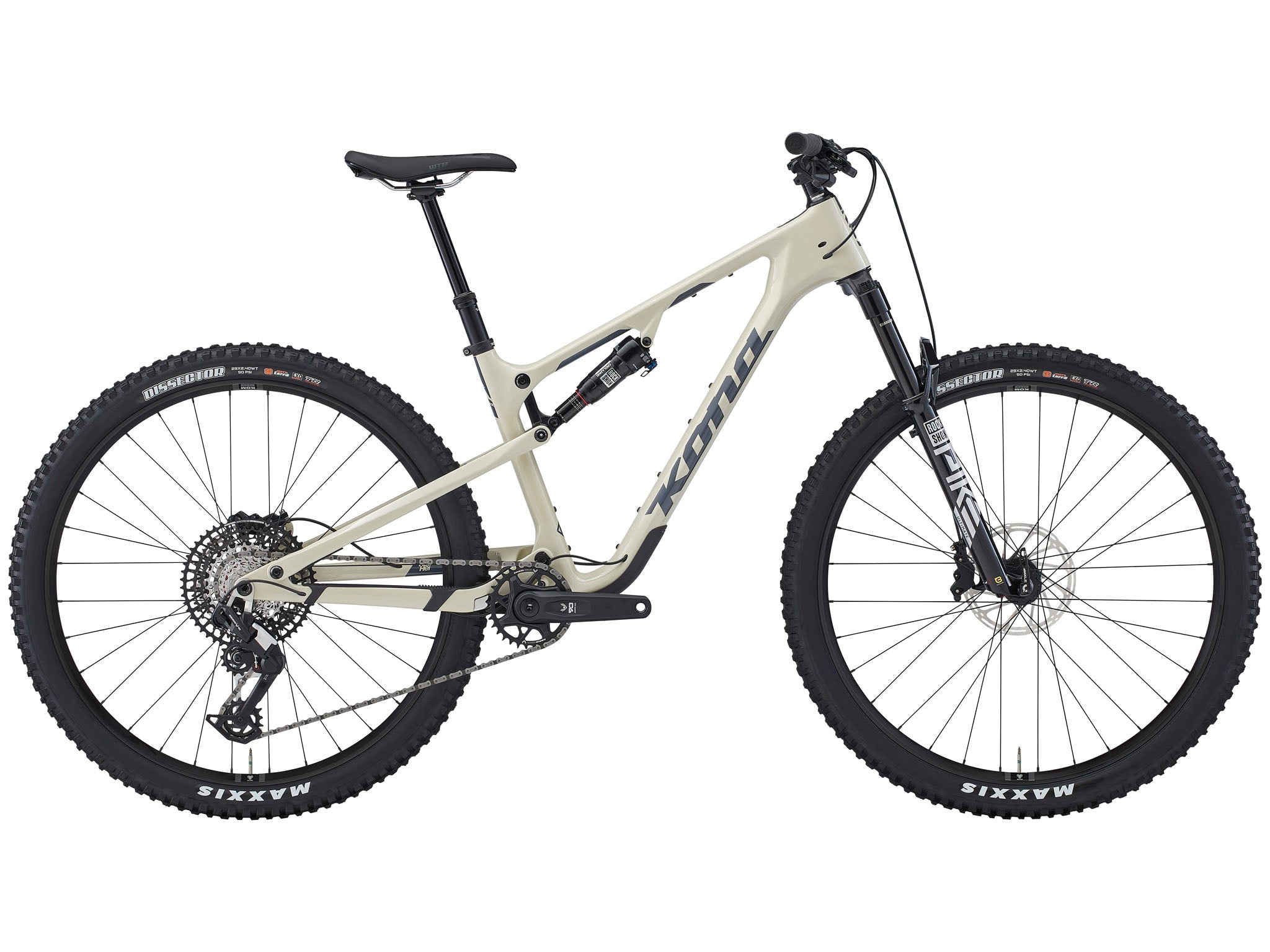 Side view of the Kona Hei Hei CR carbon mountain bike perched on a rocky ridge at sunrise, highlighting the sculpted carbon frame and 29-inch wheels ready for climbing.