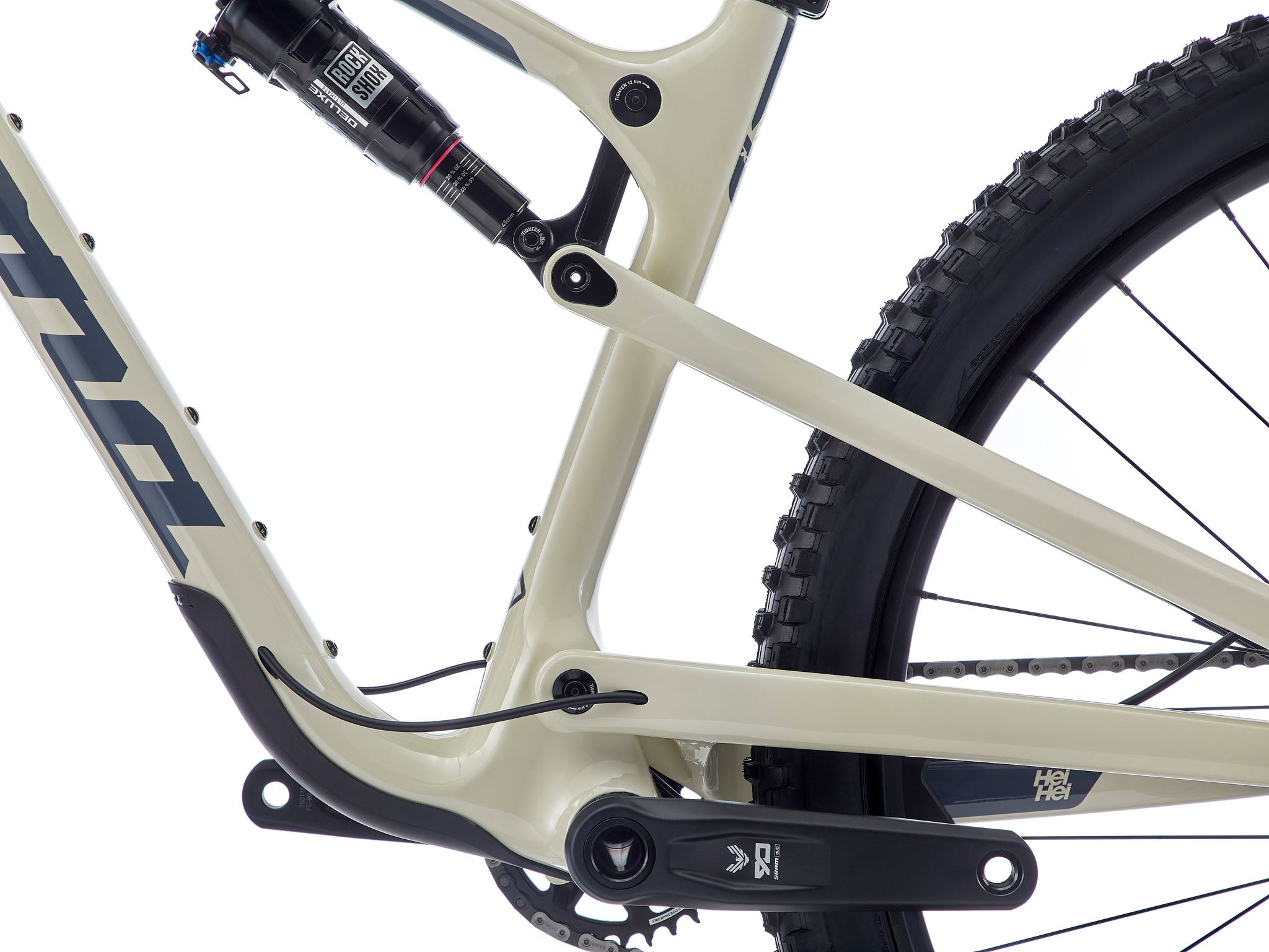 Close-up of the SRAM GX Eagle rear derailleur and 12-speed cassette on the Kona Hei Hei CR, showing crisp cable routing and lightweight carbon chainstay.