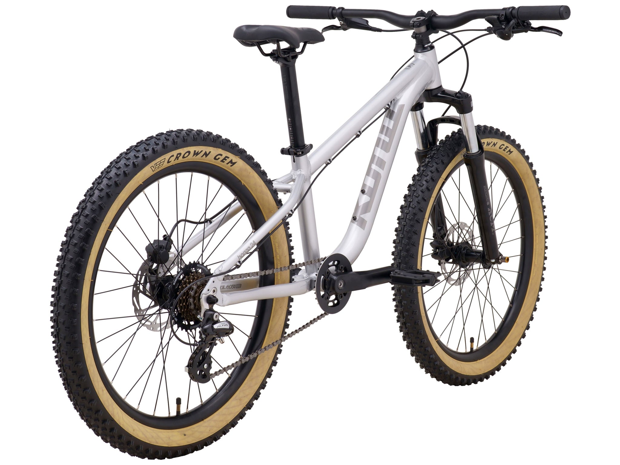 Close-up of the wide tires and suspension fork of the kids mountain bike
