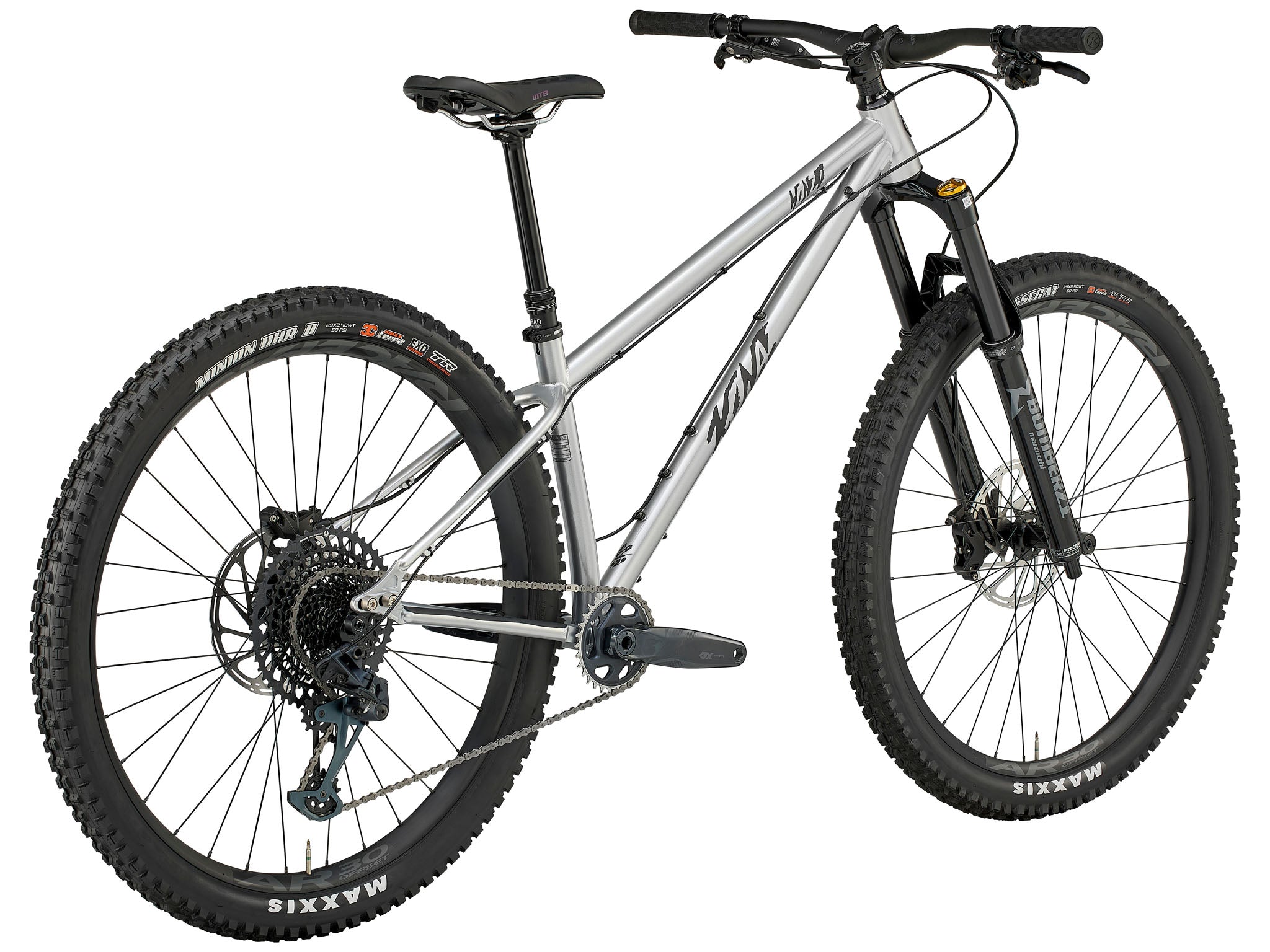 Honzo ESD leaned against a granite slab on an alpine ridge, sunset lighting the Maxxis tires and steel frame