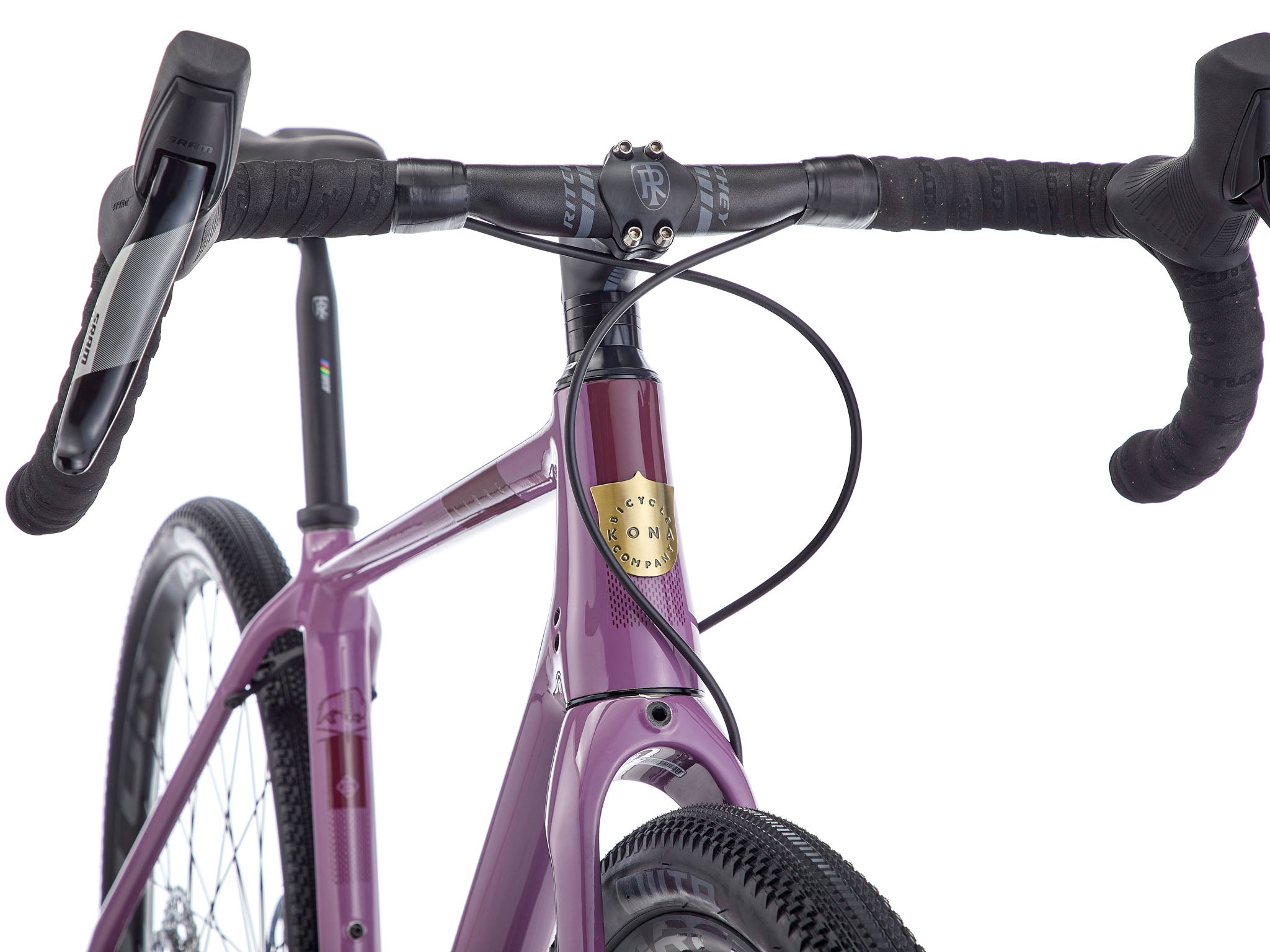 Side view of drop bar bike showcasing wide tire clearance and carbon frame design