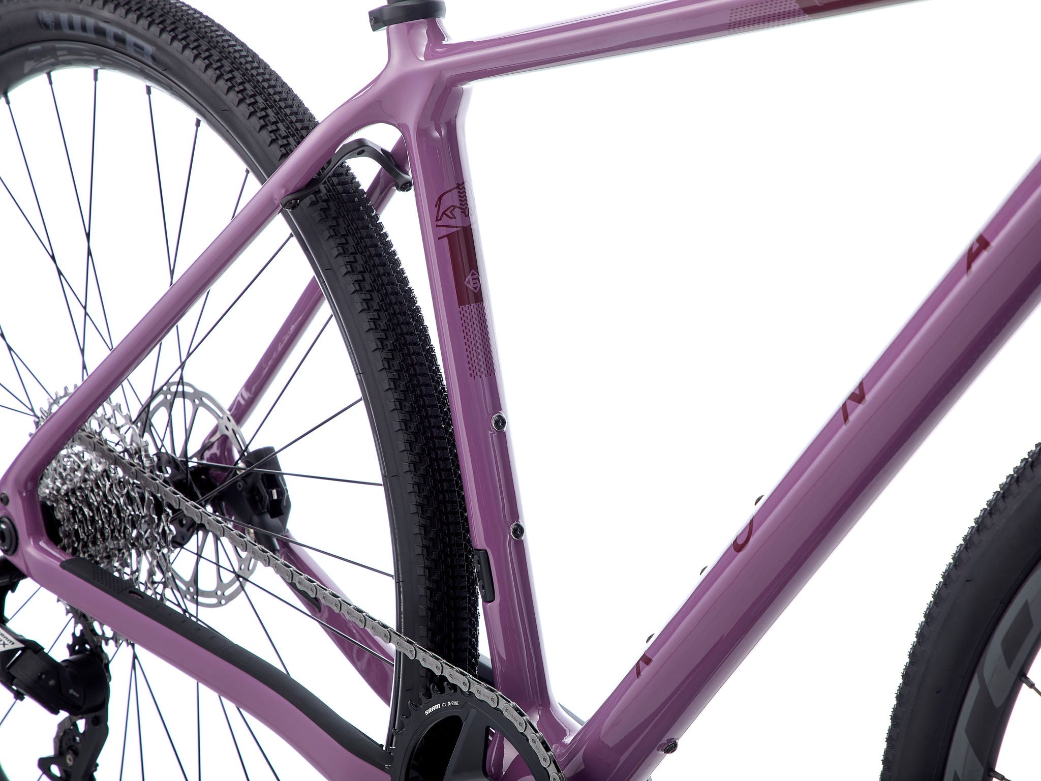 Lightweight drop bar bike for mixed terrain parked on rugged gravel trail