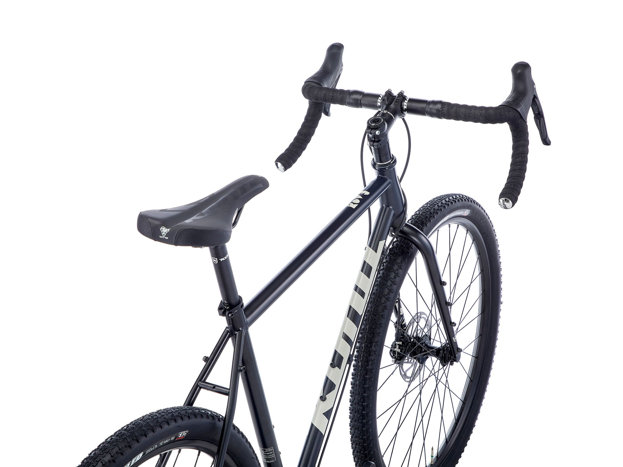 Side view of the Rove steel bike on city street for commuting