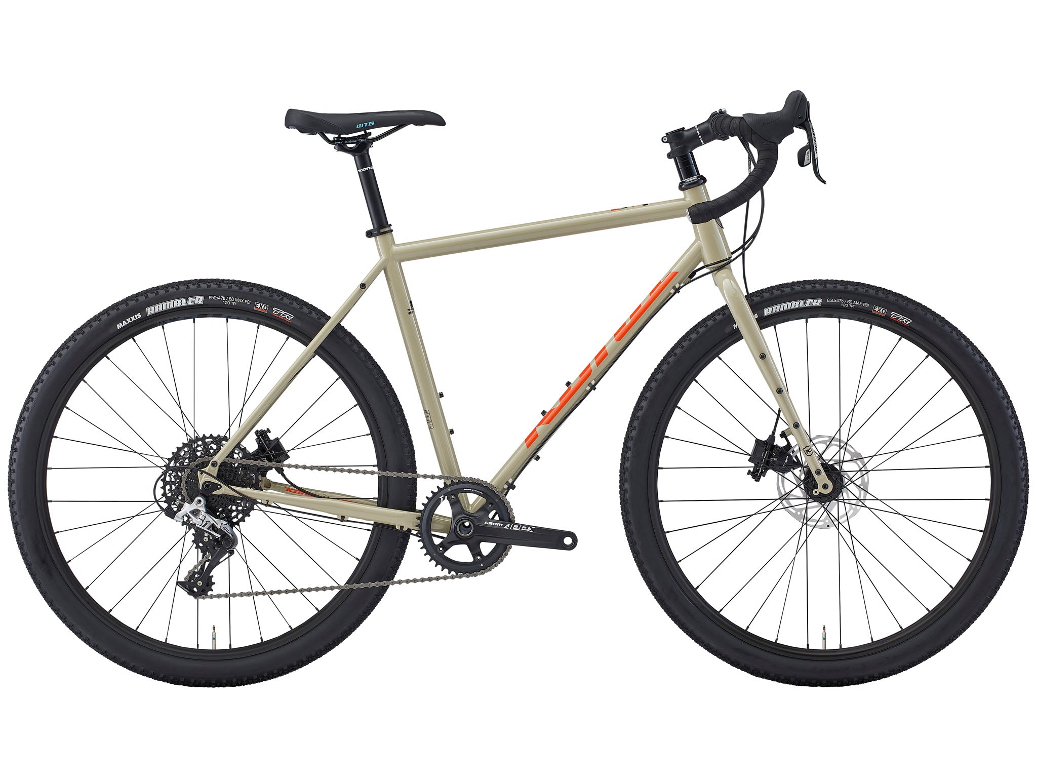 Side view of the Rove DL steel gravel bike on a forest trail, showcasing its rugged frame and all-terrain tires.