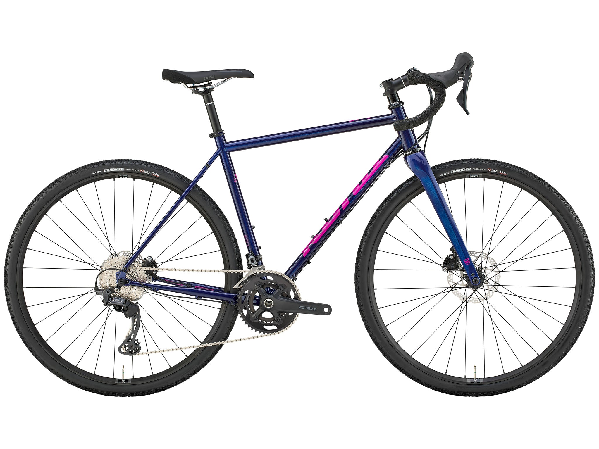 TerraVerse LTD bike on a gravel road, with a stunning mountain view in the background