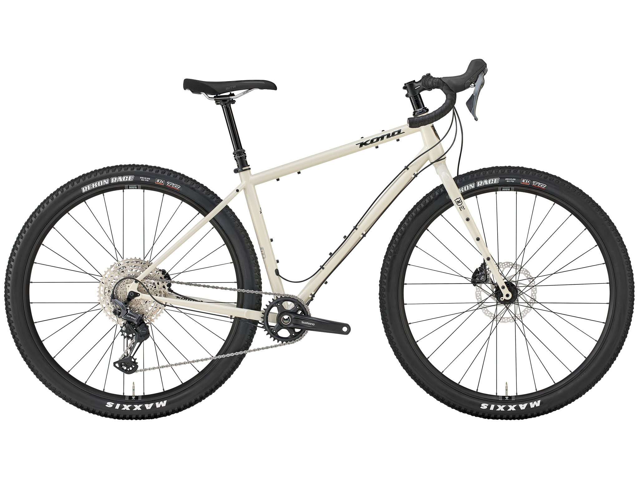 Side-profile of Sutra LTD adventure bike loaded with bike-packing bags on a misty ridge