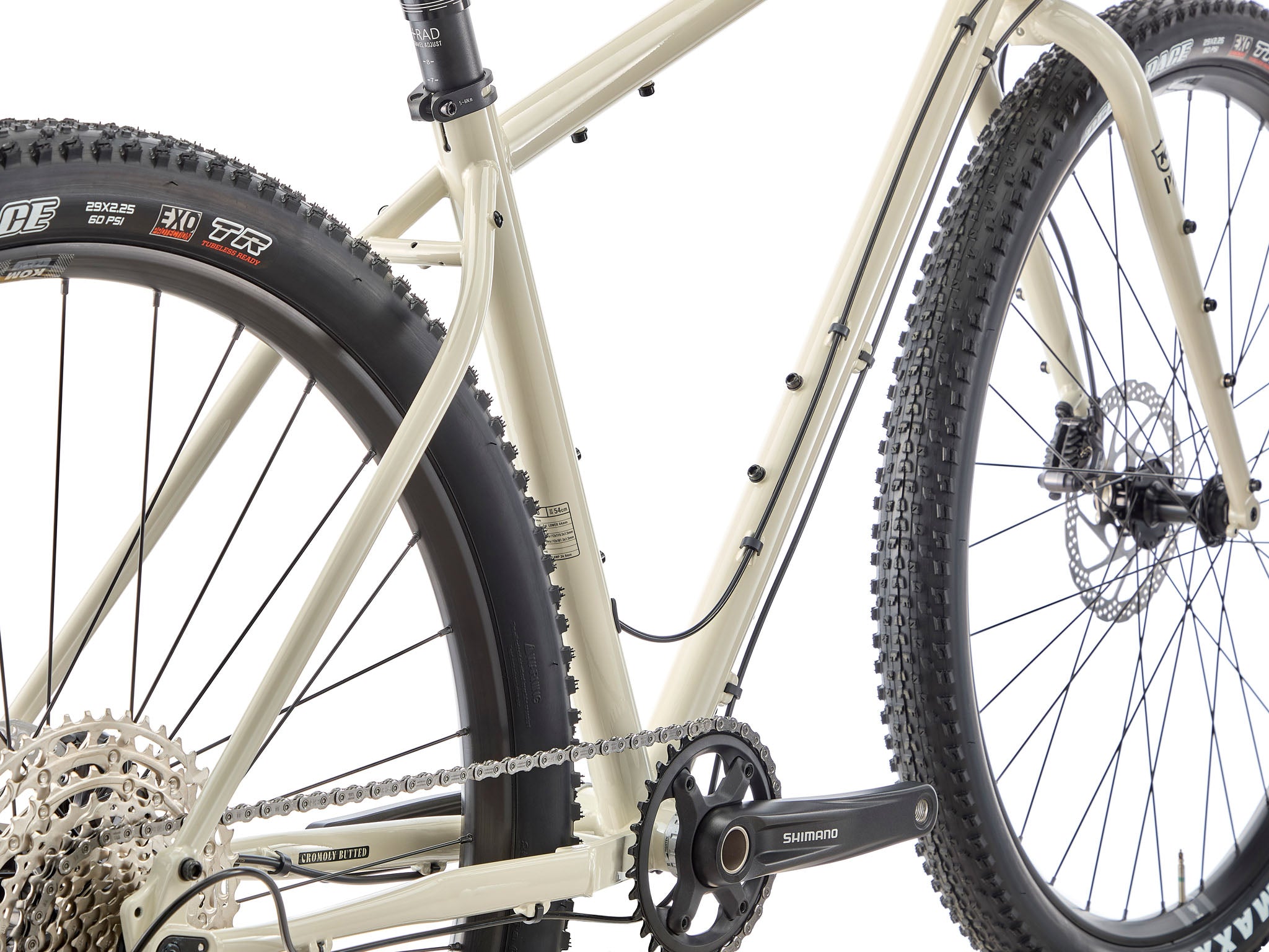 Side-profile of Sutra LTD adventure bike loaded with bike-packing bags on a misty ridge