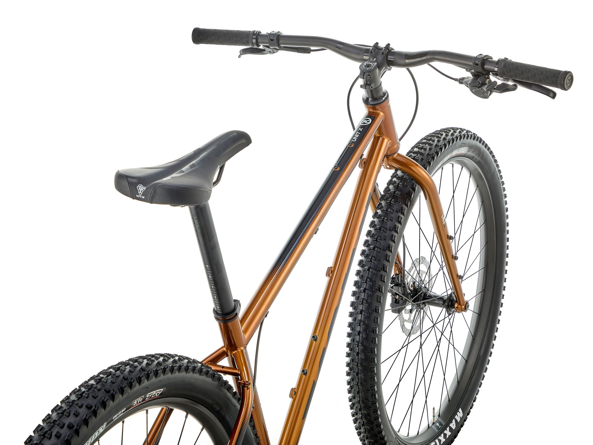 Side view of Kona Unit X bike on mountain trail, perfect for bikepacking adventures
