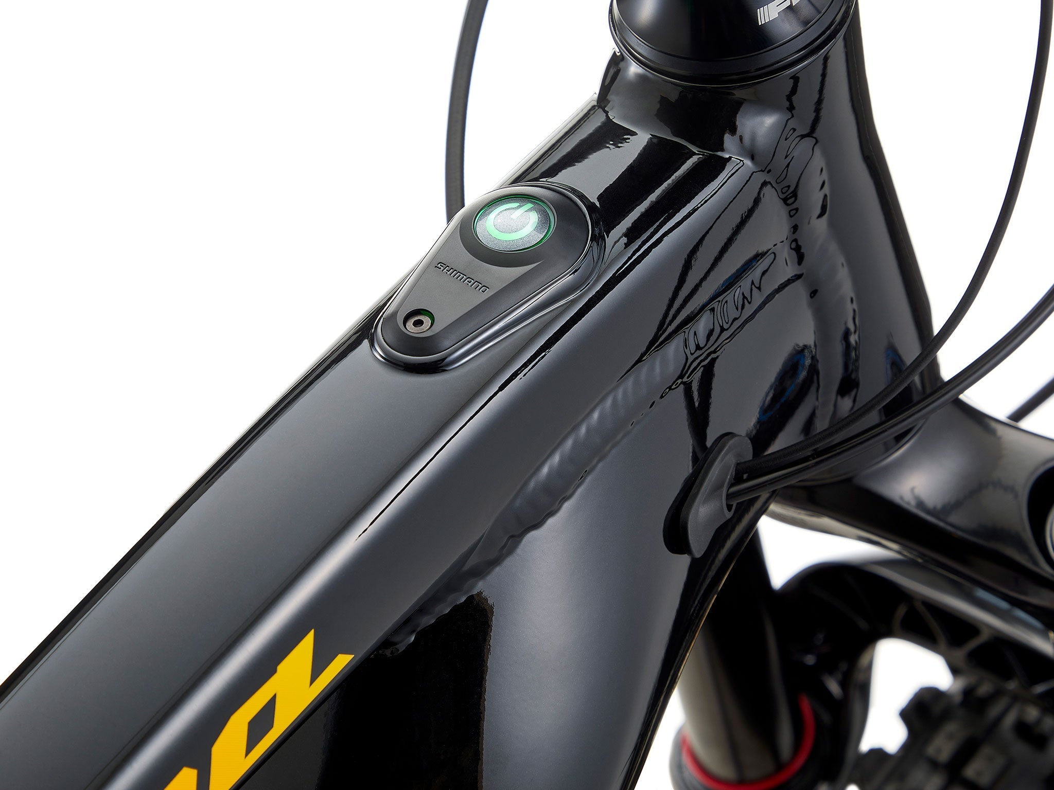 Remote 160 e-MTB on a steep trail, highlighting its hydraulic brakes and Shimano motor.