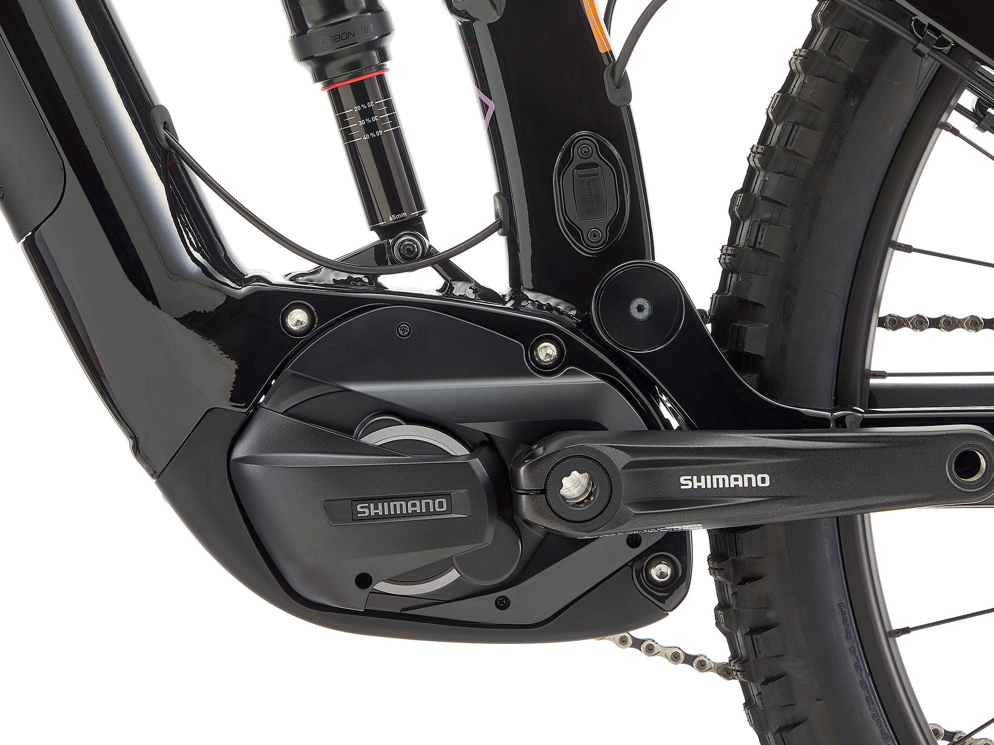 Remote 160 e-MTB on a steep trail, highlighting its hydraulic brakes and Shimano motor.