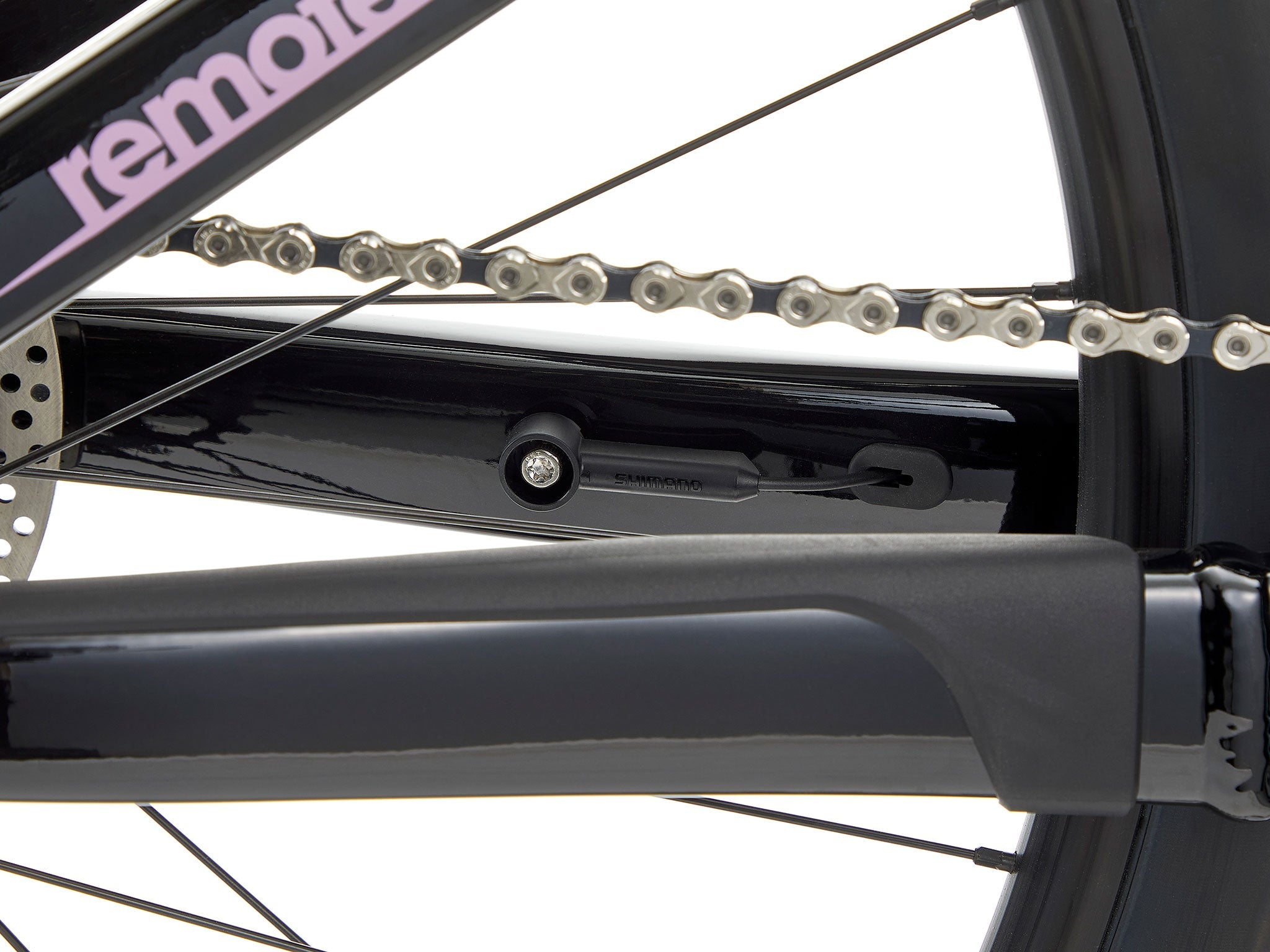 Remote 160 e-MTB on a steep trail, highlighting its hydraulic brakes and Shimano motor.