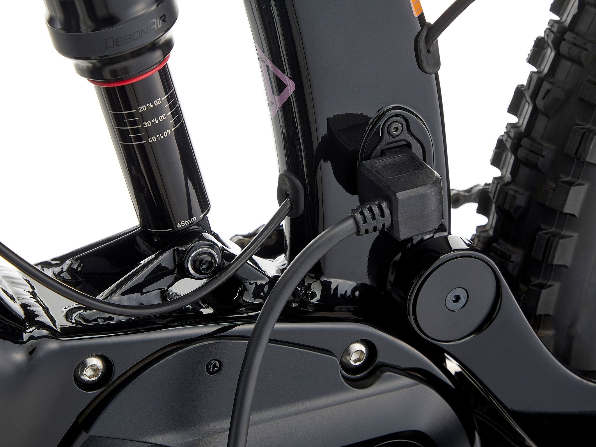 Remote 160 e-MTB in action, descending a rocky path, demonstrating its 160mm travel capabilities.