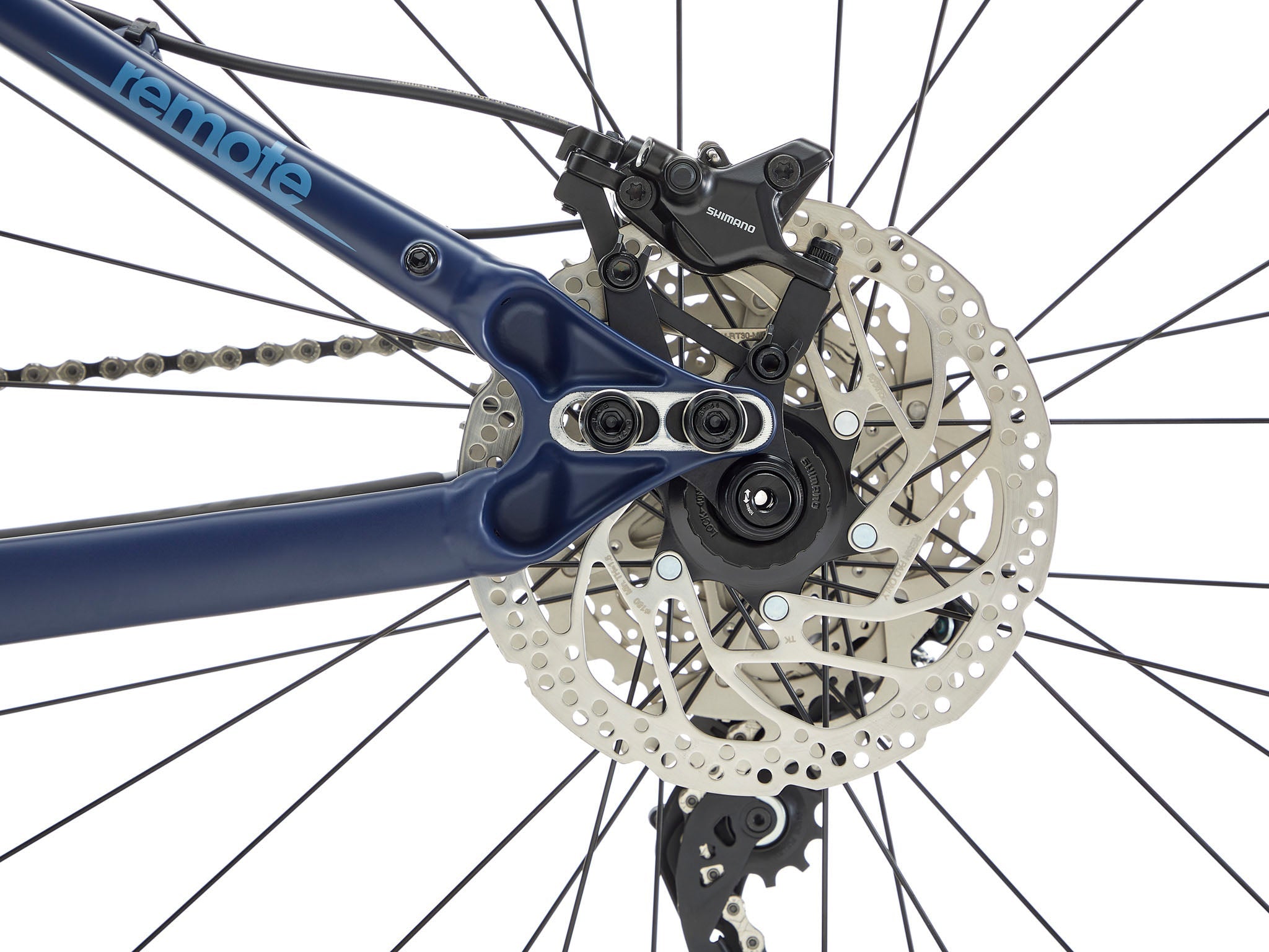 Side view of Kona Remote TrailMaster 140 e-MTB parked on a forest trail, showcasing its rugged frame and Shimano motor.