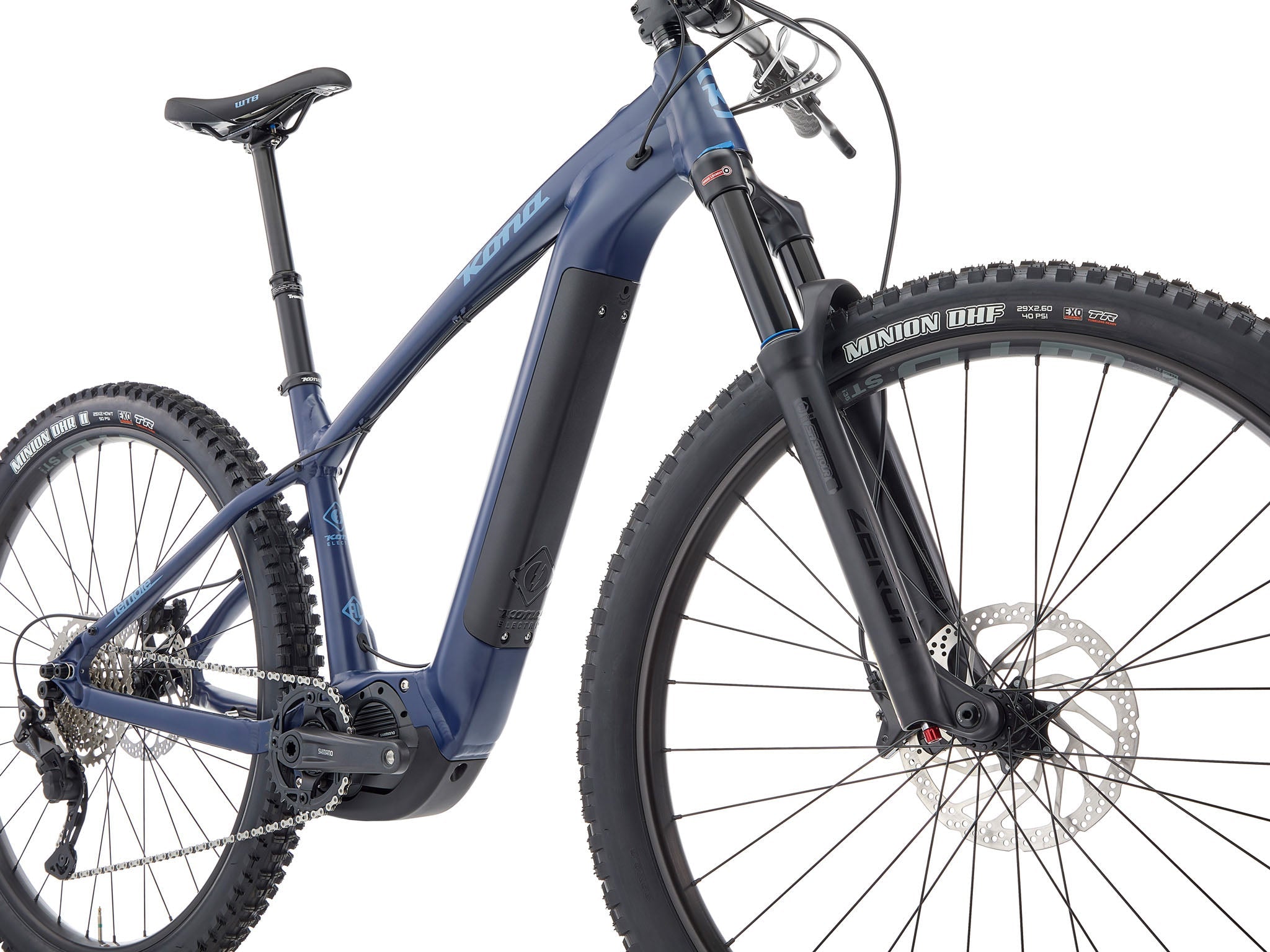 Action shot of a rider navigating rocky terrain with the Kona Remote TrailMaster 140, demonstrating its 140mm suspension in action.