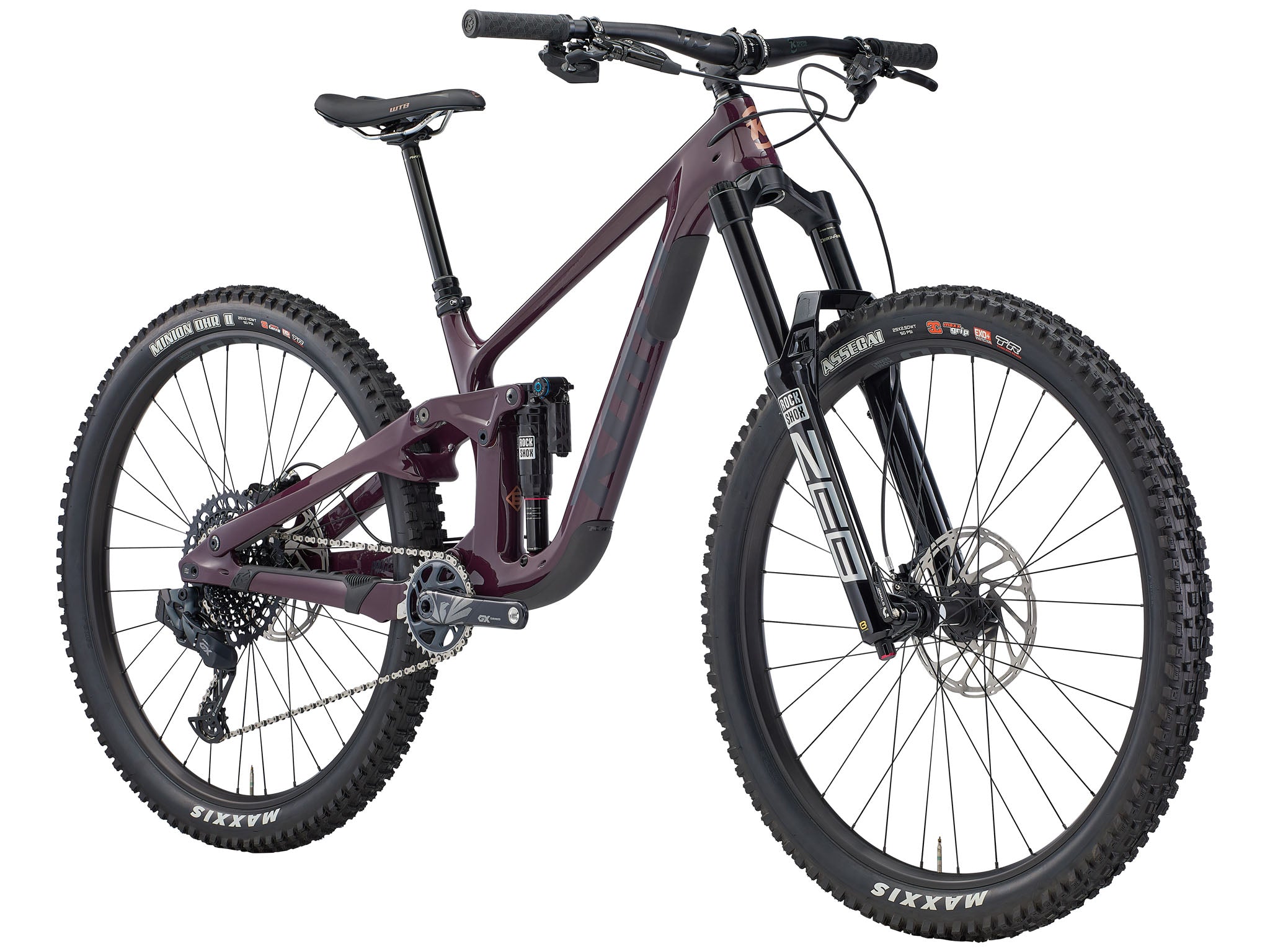 Action shot of rider descending rocky trail on the Kona Process X DL, highlighting 170mm travel
