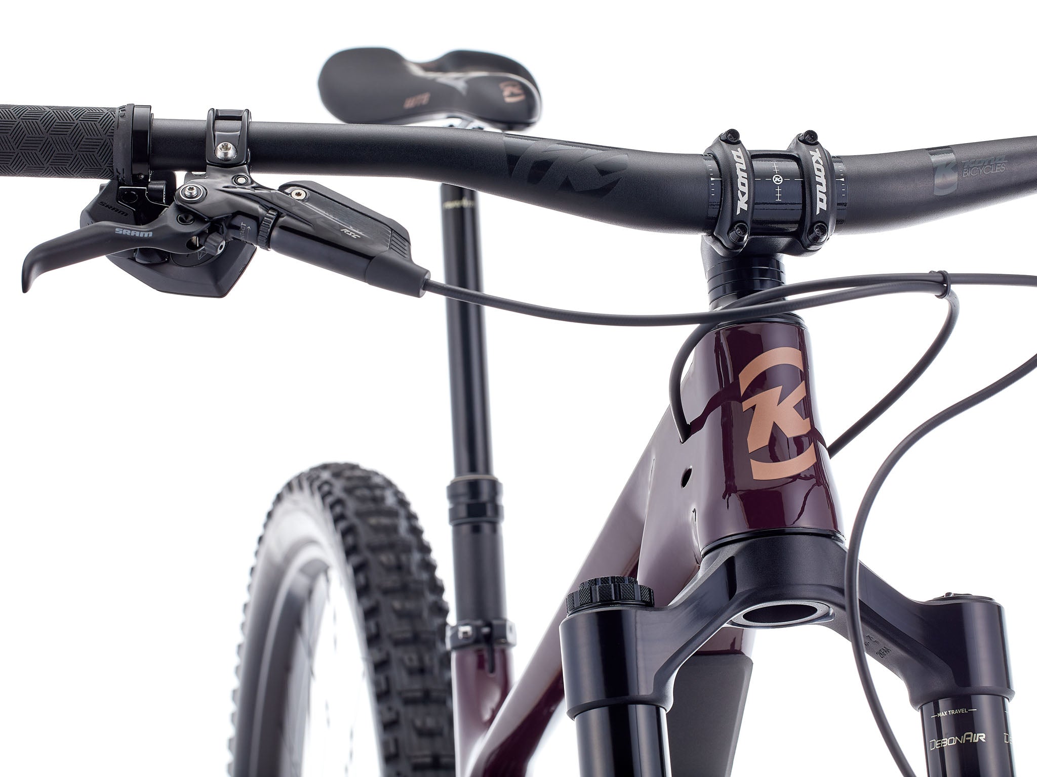 Action shot of rider descending rocky trail on the Kona Process X DL, highlighting 170mm travel