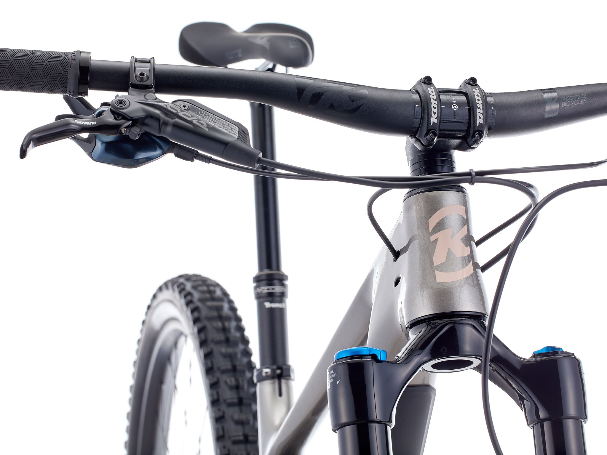 Close-up of the 170 mm rear linkage and alloy rocker arm under golden-hour light