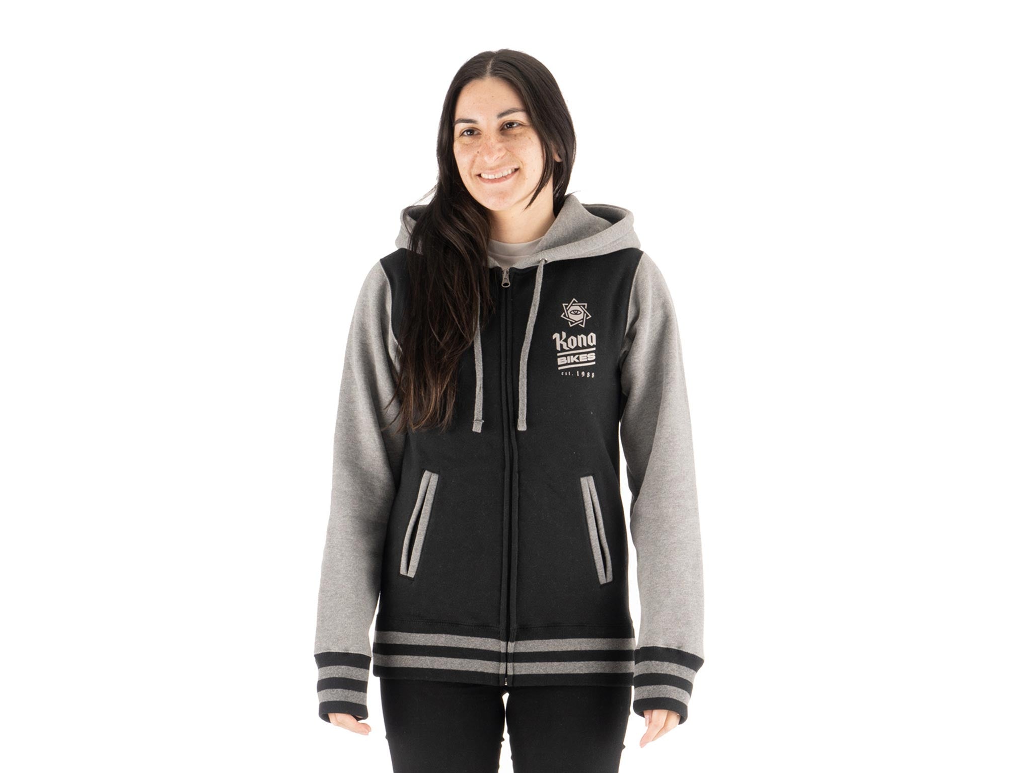 Model wearing trendy hoodies for college students in a casual outdoor setting