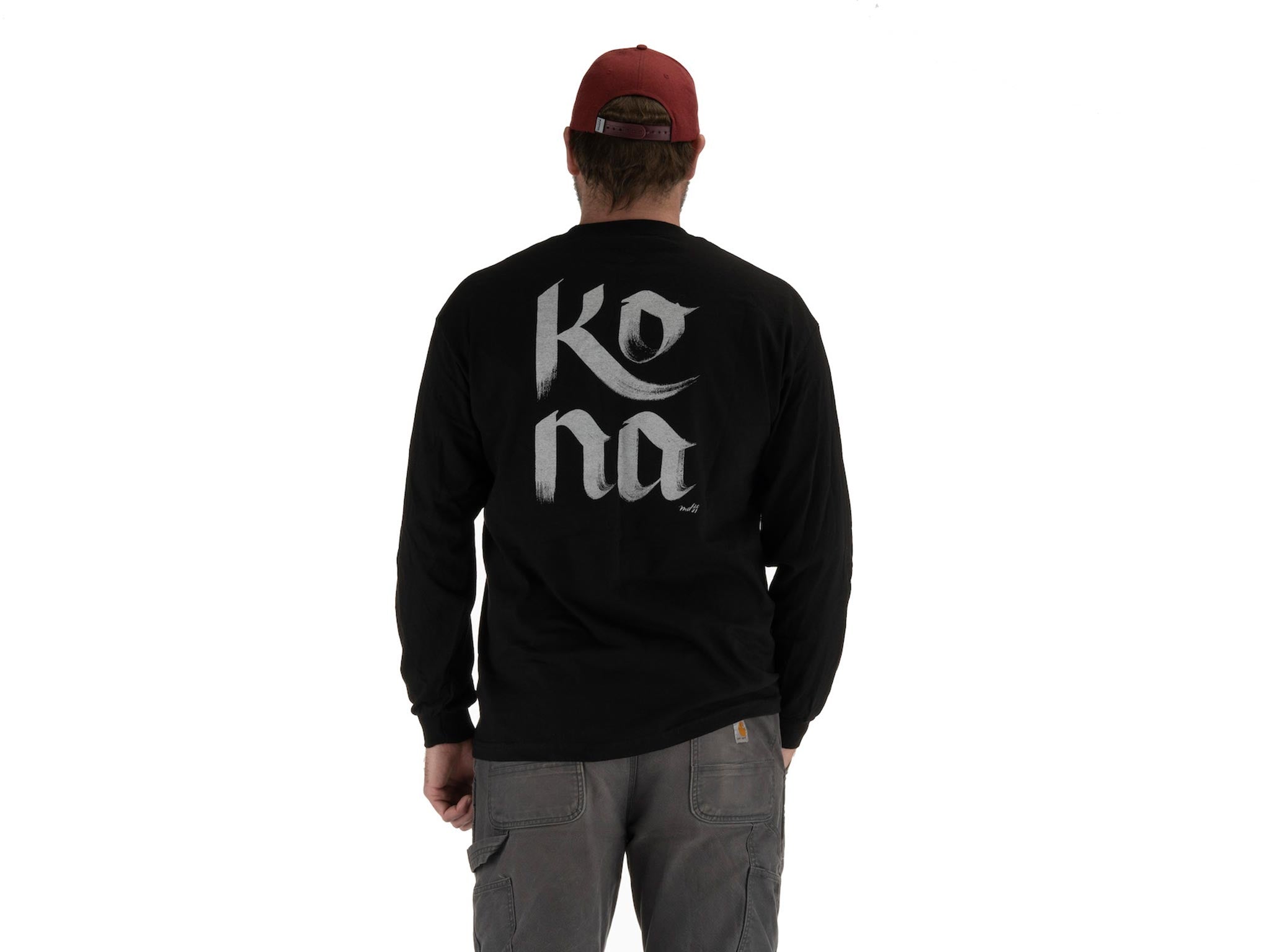 Model wearing Mary Do Calligraphy Long Sleeve T-Shirt outdoors, highlighting its versatility.