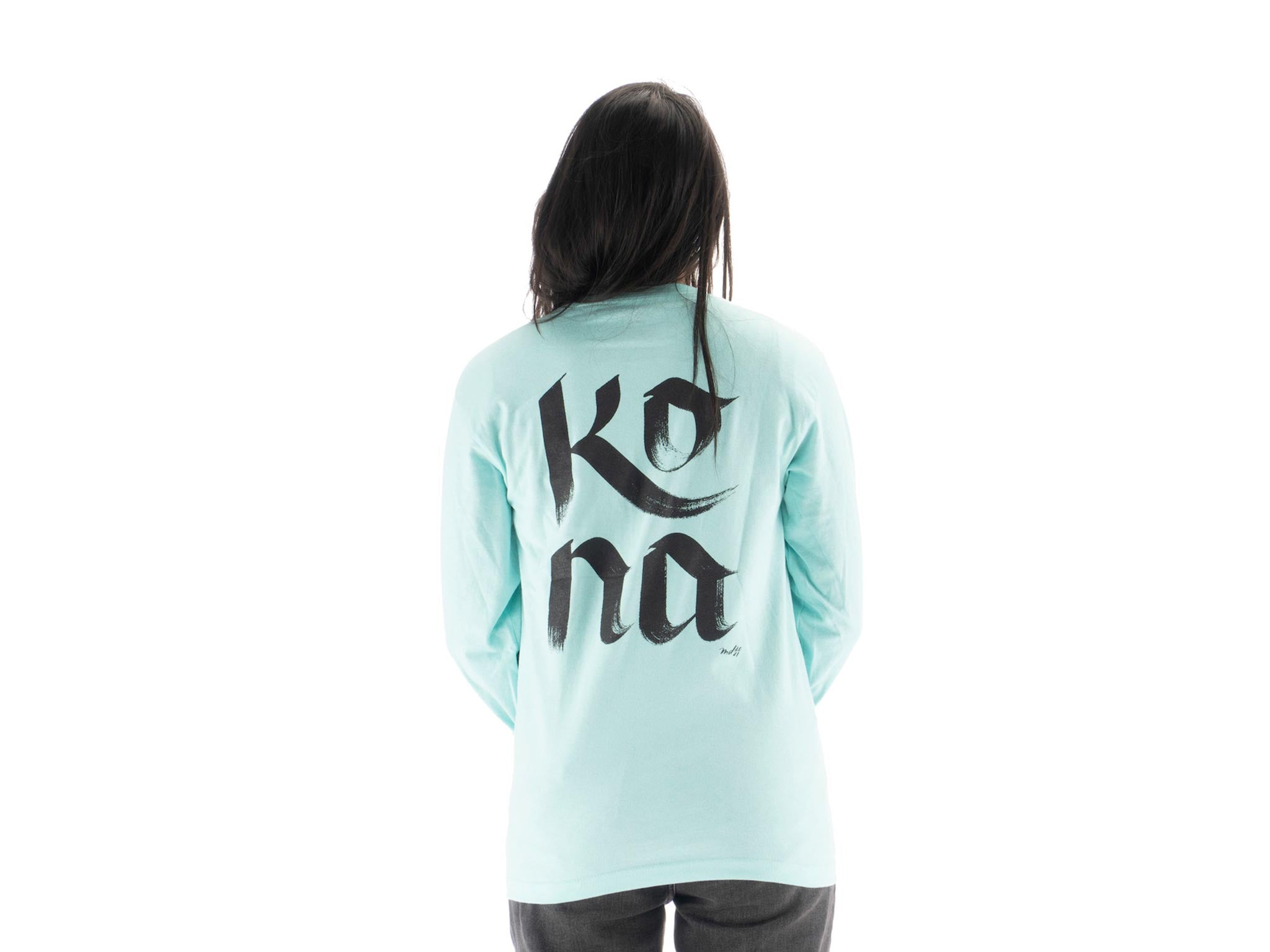 Model wearing Mary Do Calligraphy Long Sleeve T-Shirt outdoors, highlighting its versatility.