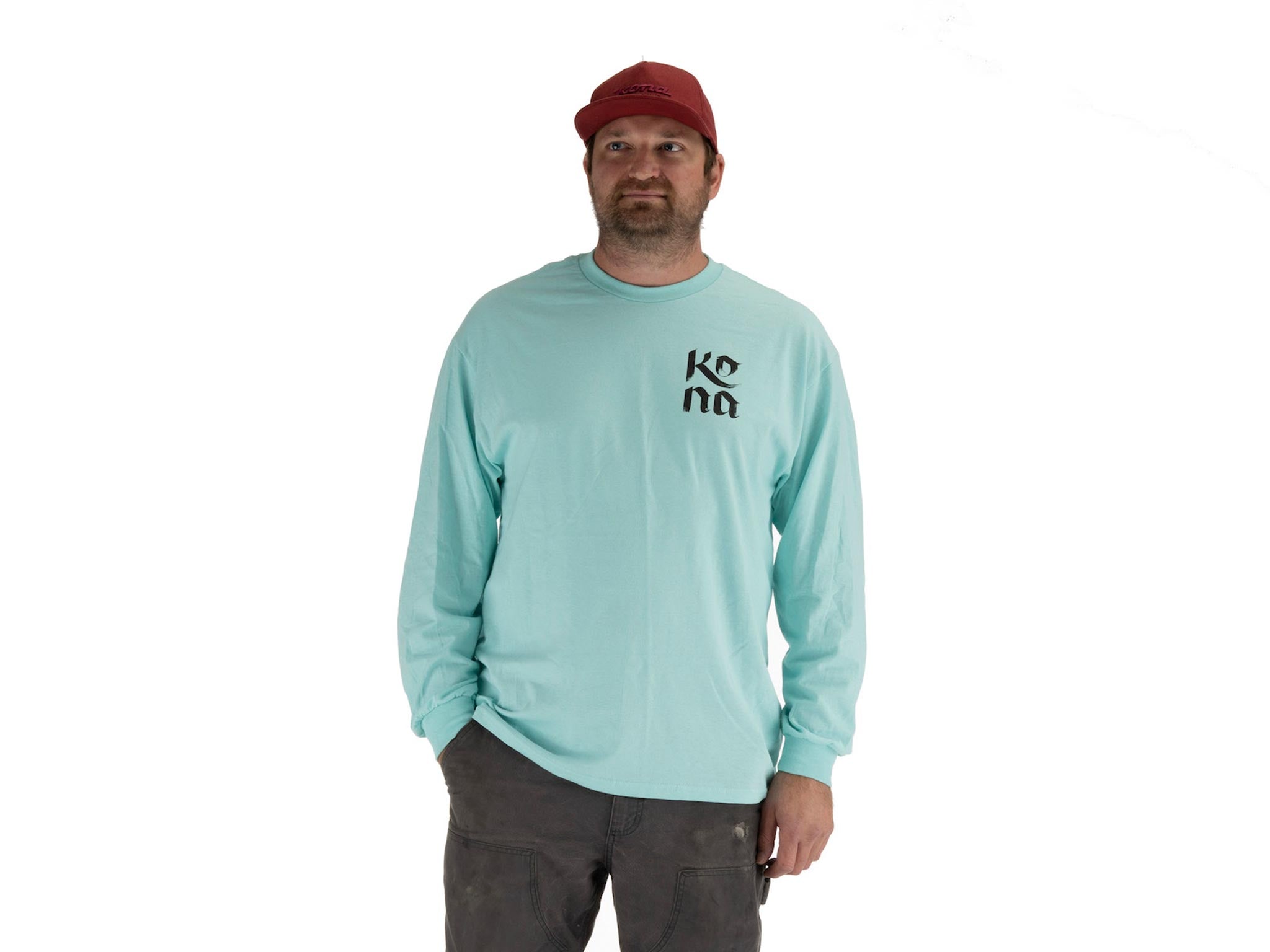 Model wearing Mary Do Calligraphy Long Sleeve T-Shirt outdoors, highlighting its versatility.