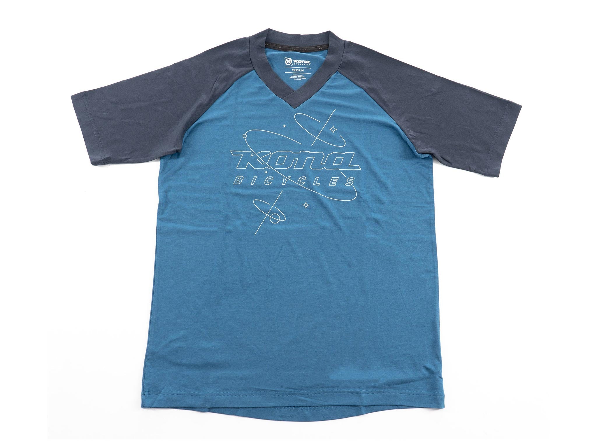 Close-up of top rated tech fabric weave showing micro-ventilation holes and reflective orbit logo
