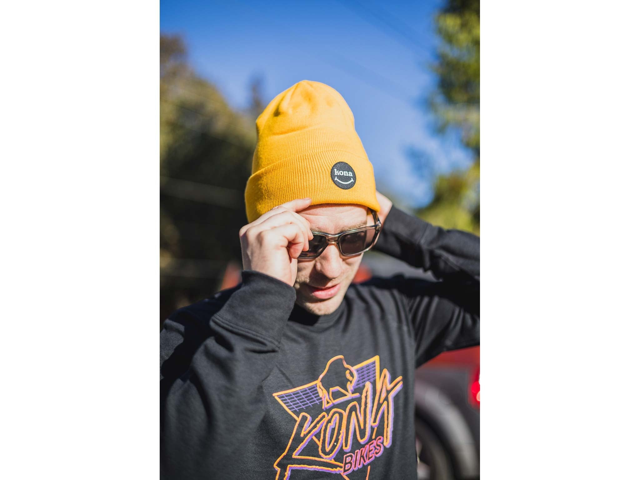 Joyful Journeys Beanie in black and gold, perfect for winter cycling.