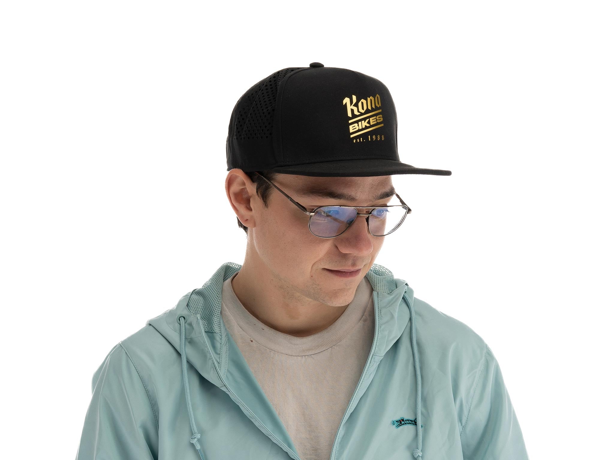 Side view of the Brewed Athletic Trucker Hat highlighting its adjustable snap-back feature.