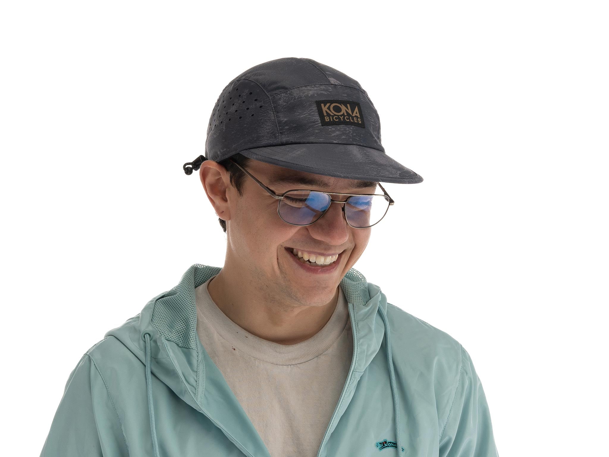 Close-up of Kona Ink Cap showing breathable perforations and UPF 50+ fabric