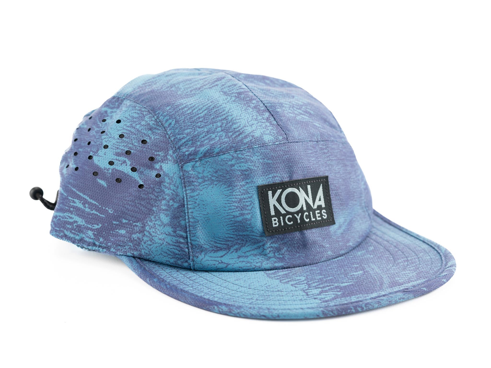 Cyclist wearing the Kona Ink Cap on a sunny trail, demonstrating sun protection and fit