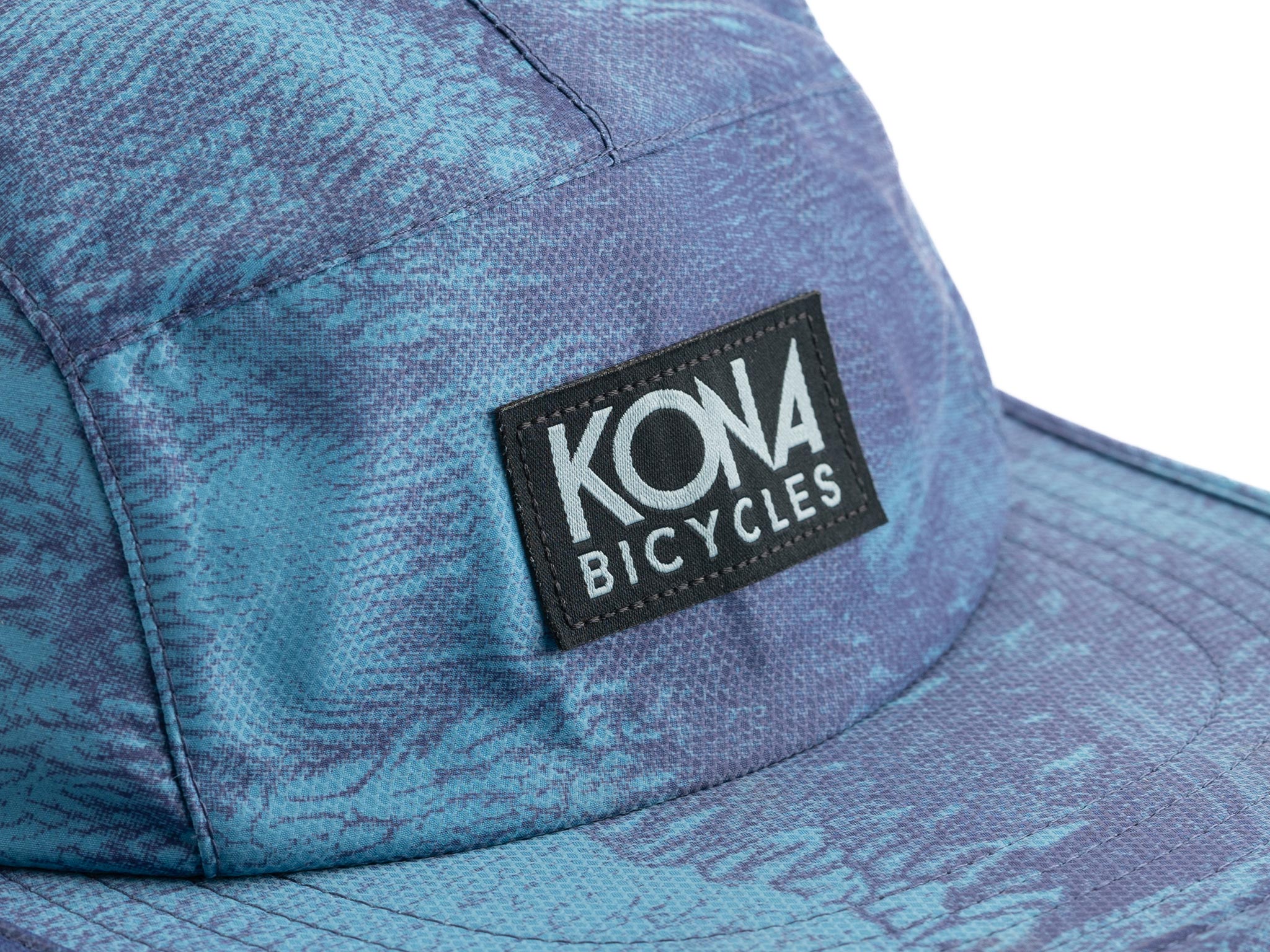 Close-up of Kona Ink Cap showing breathable perforations and UPF 50+ fabric