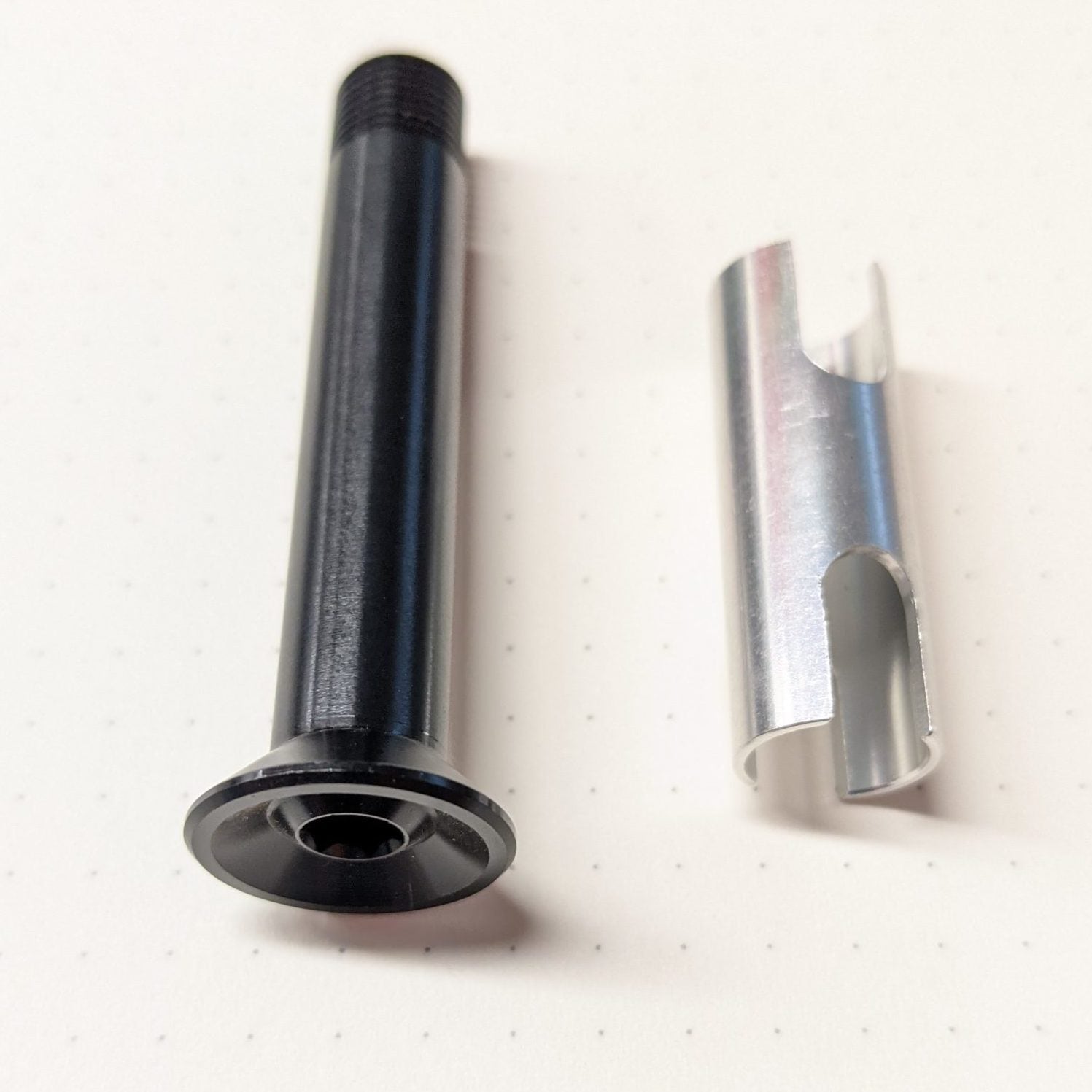 Hei Hei AL 29 rocker pivot bolt showcasing its tapered head design.