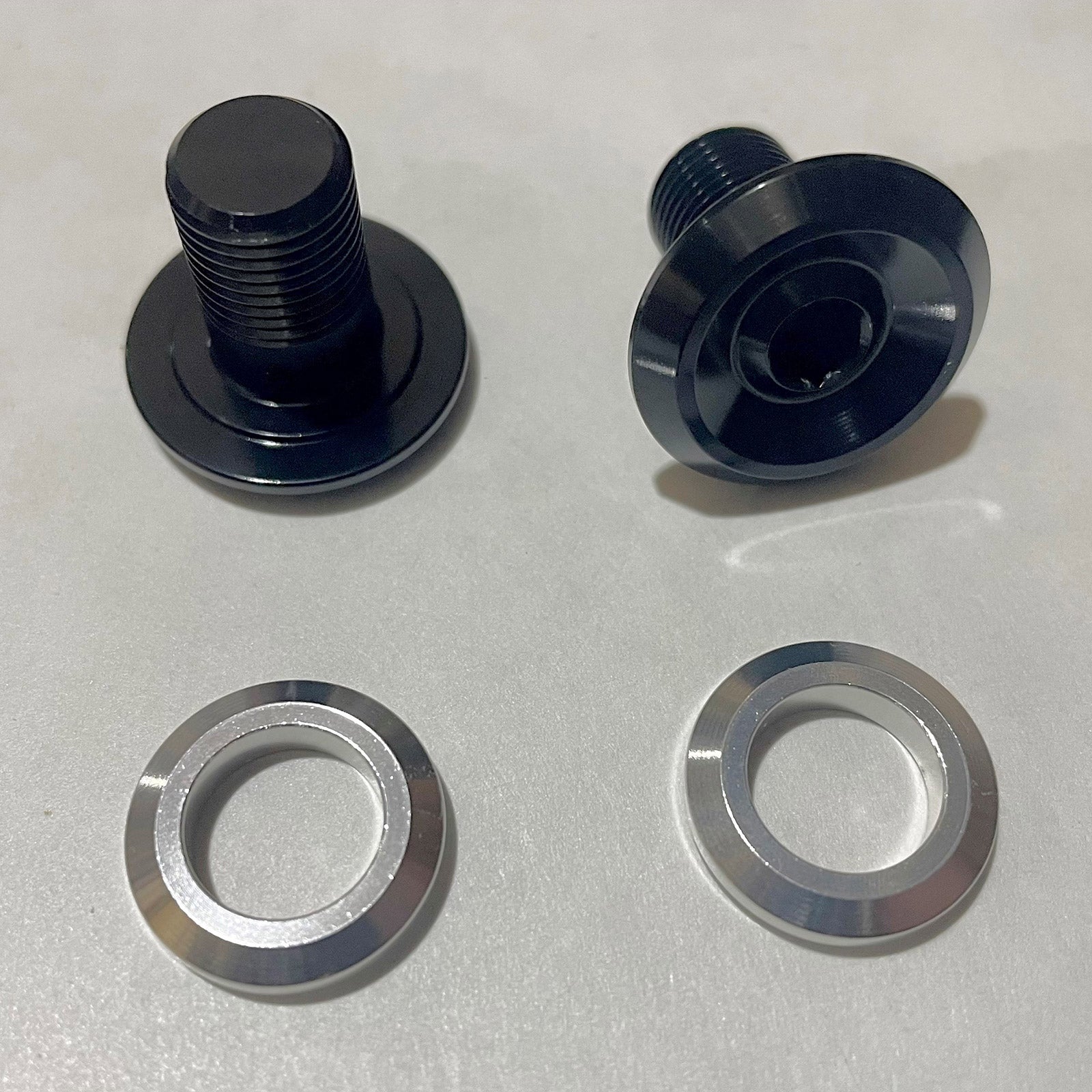 Close-up of the Ultimate Trunnion Shock Bolt and Washer Set showcasing its precision-engineered trunnion bolts.