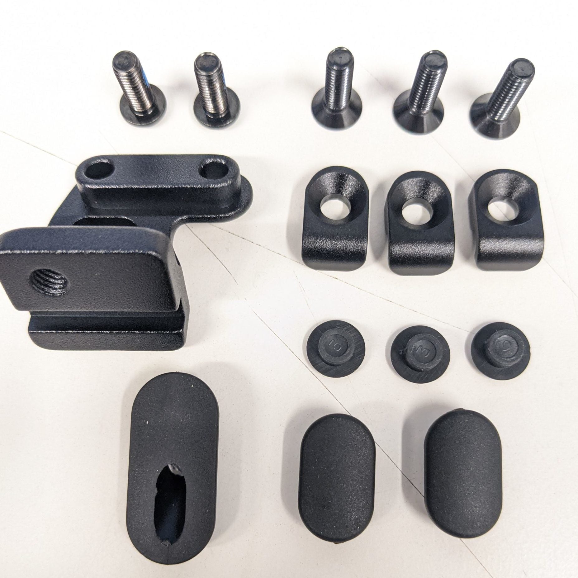 Close-up of the cable guide kit showing all components.