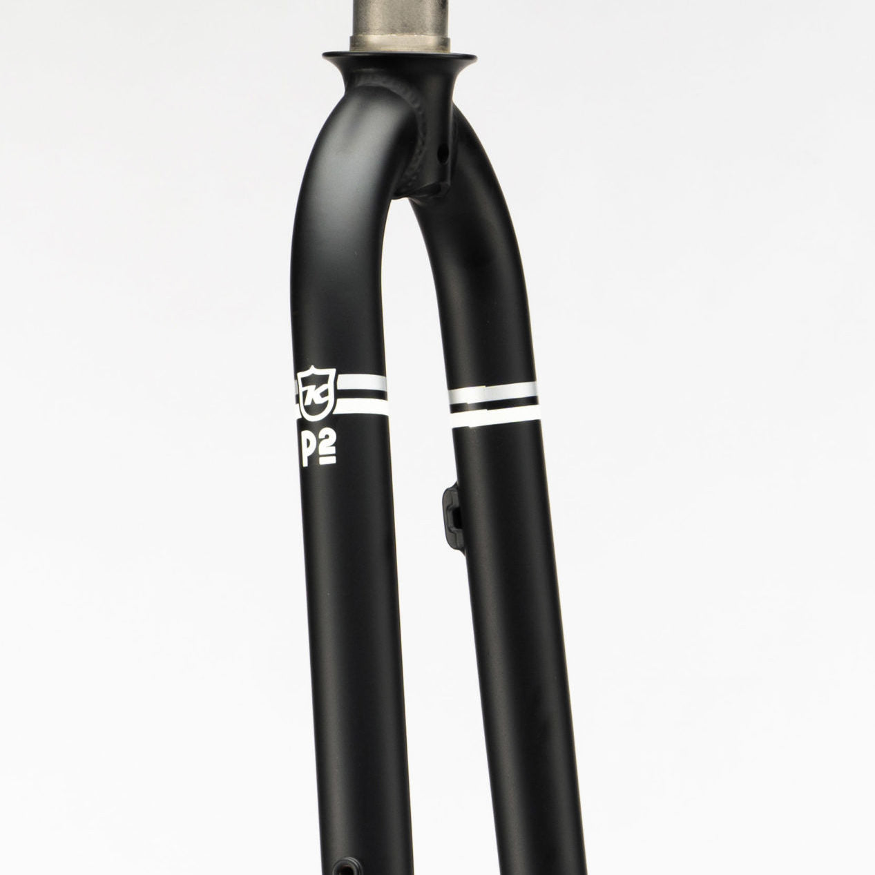 Close-up of Kona P2 700c touring fork showing matte black finish and white decals