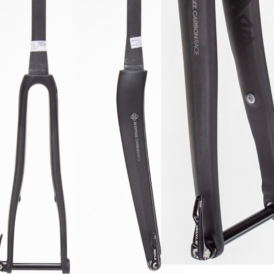 Kona Carbon Road Bike Fork from the side, emphasizing its lightweight structure and matte finish.