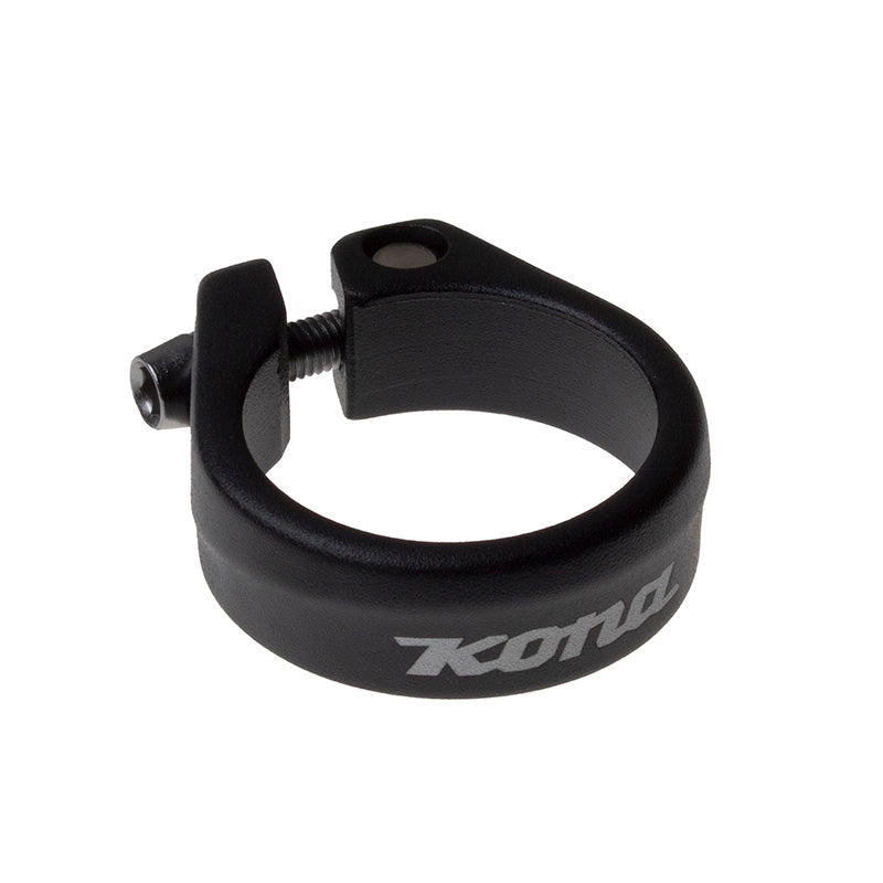 Side view of DLX 34.9 seat clamp showing laser-etched Kona logo on matte black finish