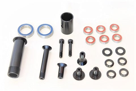 Close-up of premium bushing and bolt kit components for mountain bike maintenance.