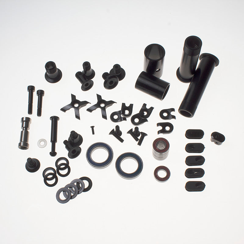 Close-up of the EnduroSync rebuild kit components neatly arranged—frame bearings, pivot bolts, and bushings for 2019 Hei Hei Satori