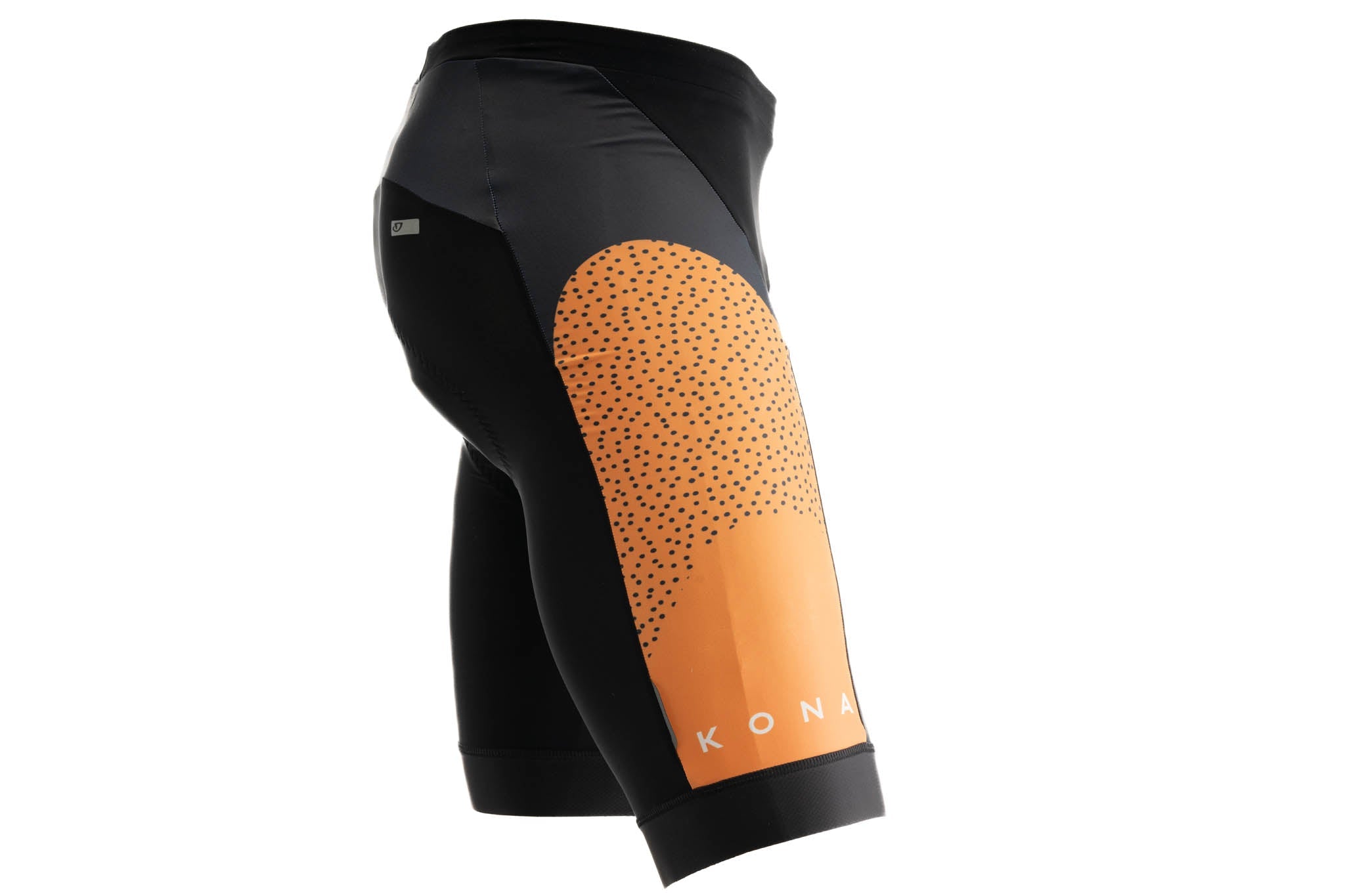 Cyclist wearing padded shorts on a scenic route, highlighting the snug fit and comfort.