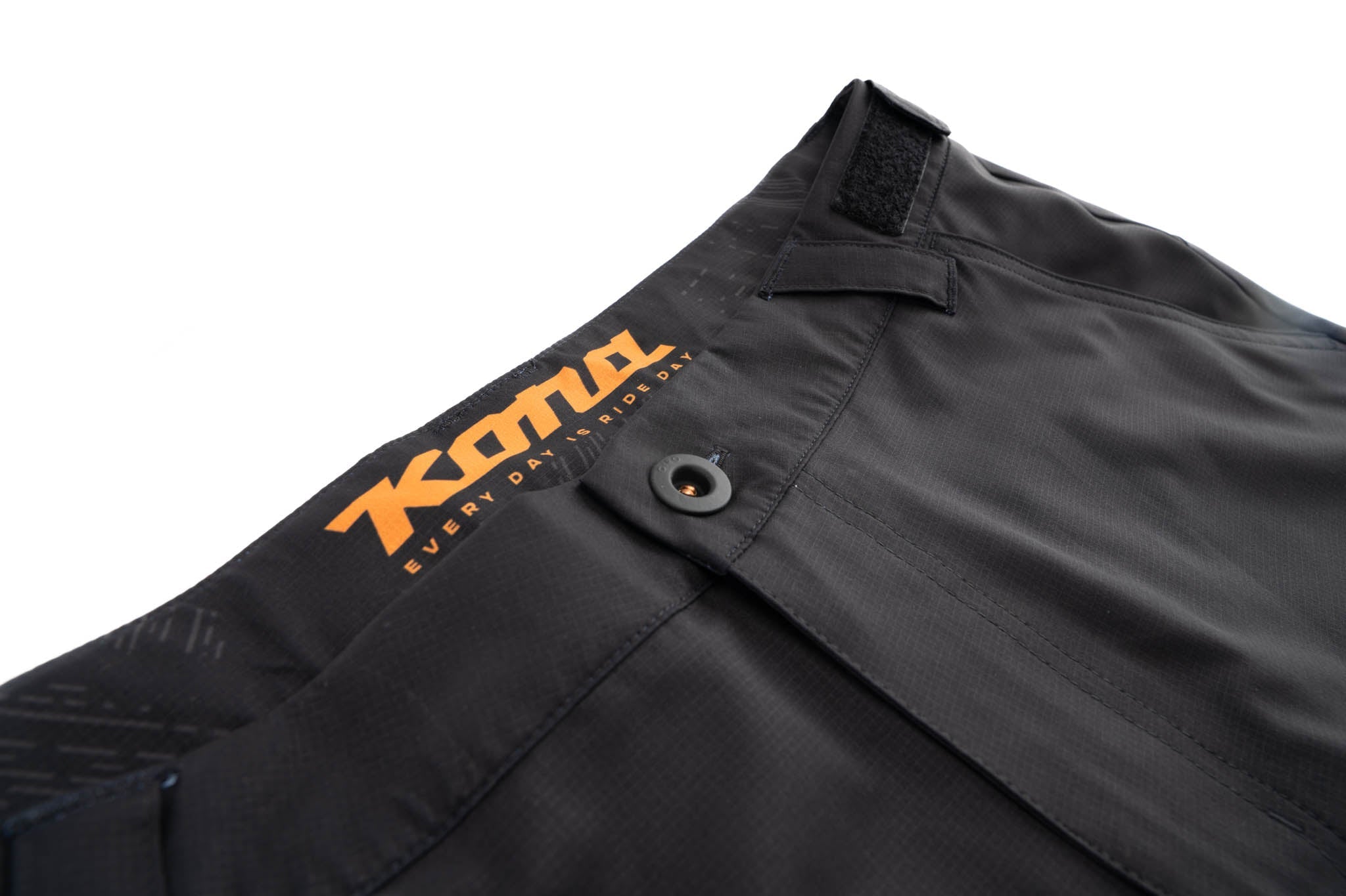 Mens cycling shorts with adjustable waist tabs and secure zip pocket.