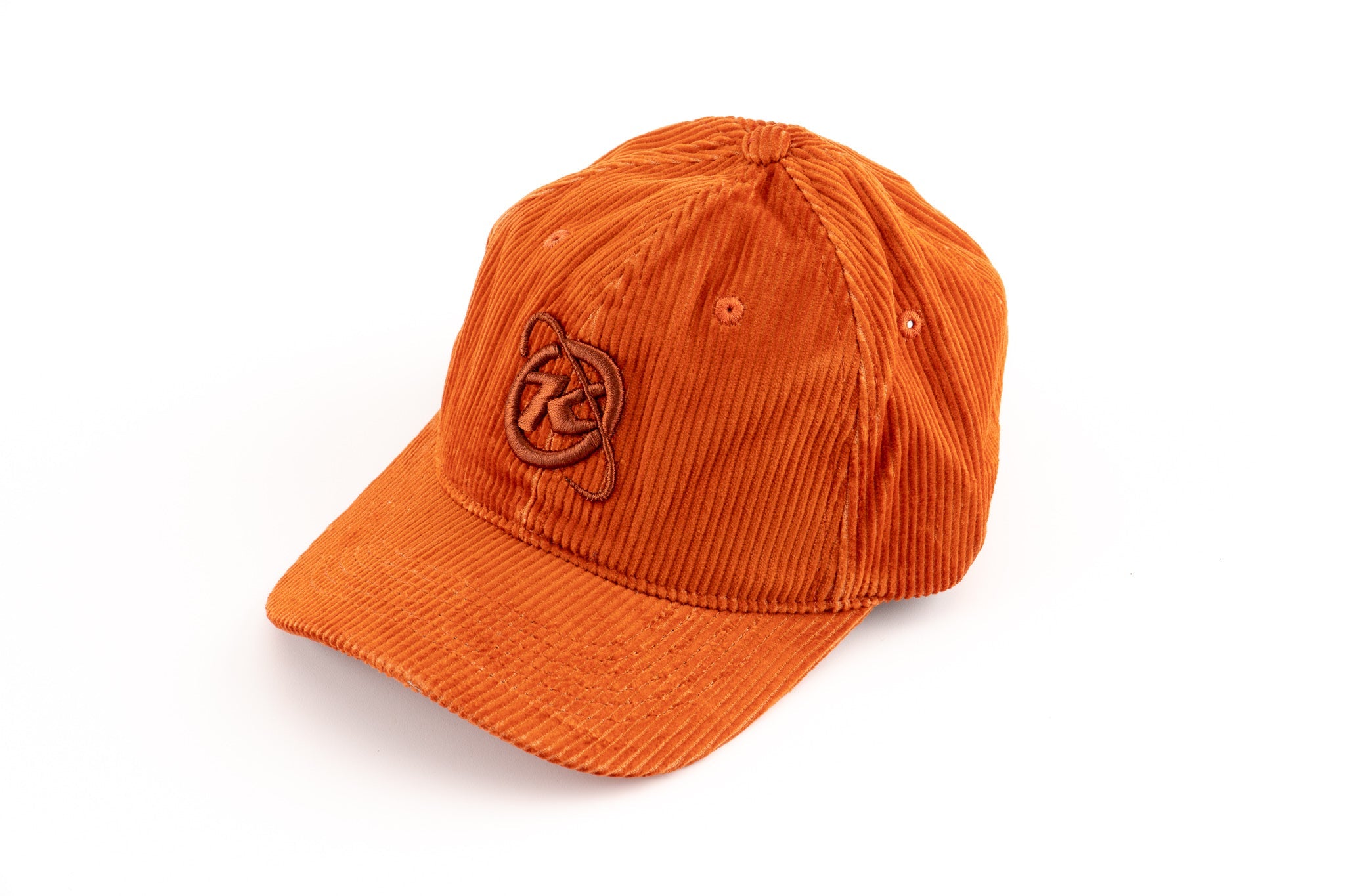 Front view of burnt orange corduroy hat showing mountain embroidery on crown