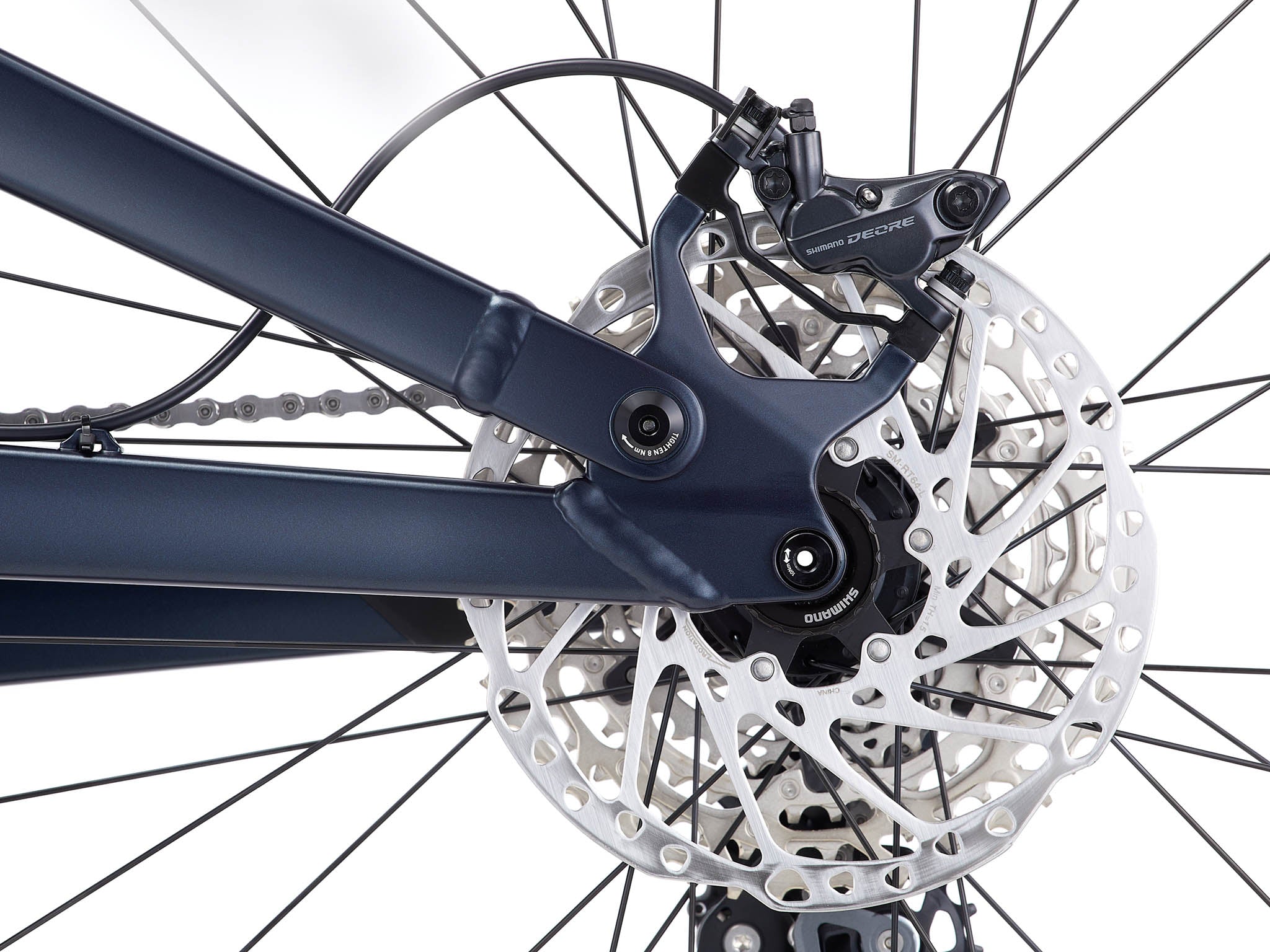 Side view of the Process X aluminum mountain bike in a bike park setting, ready for jumps