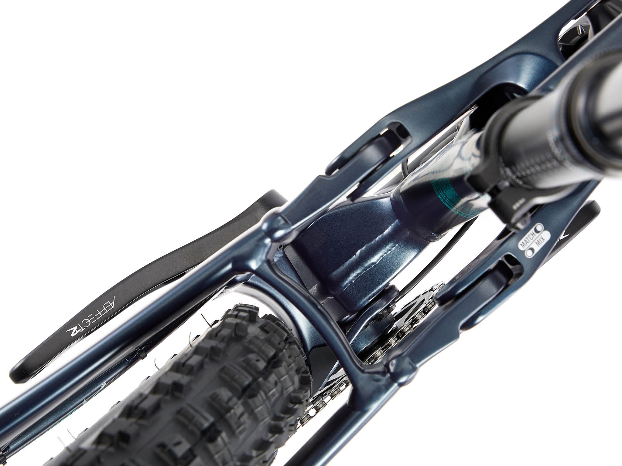 Side view of the Process X aluminum mountain bike in a bike park setting, ready for jumps