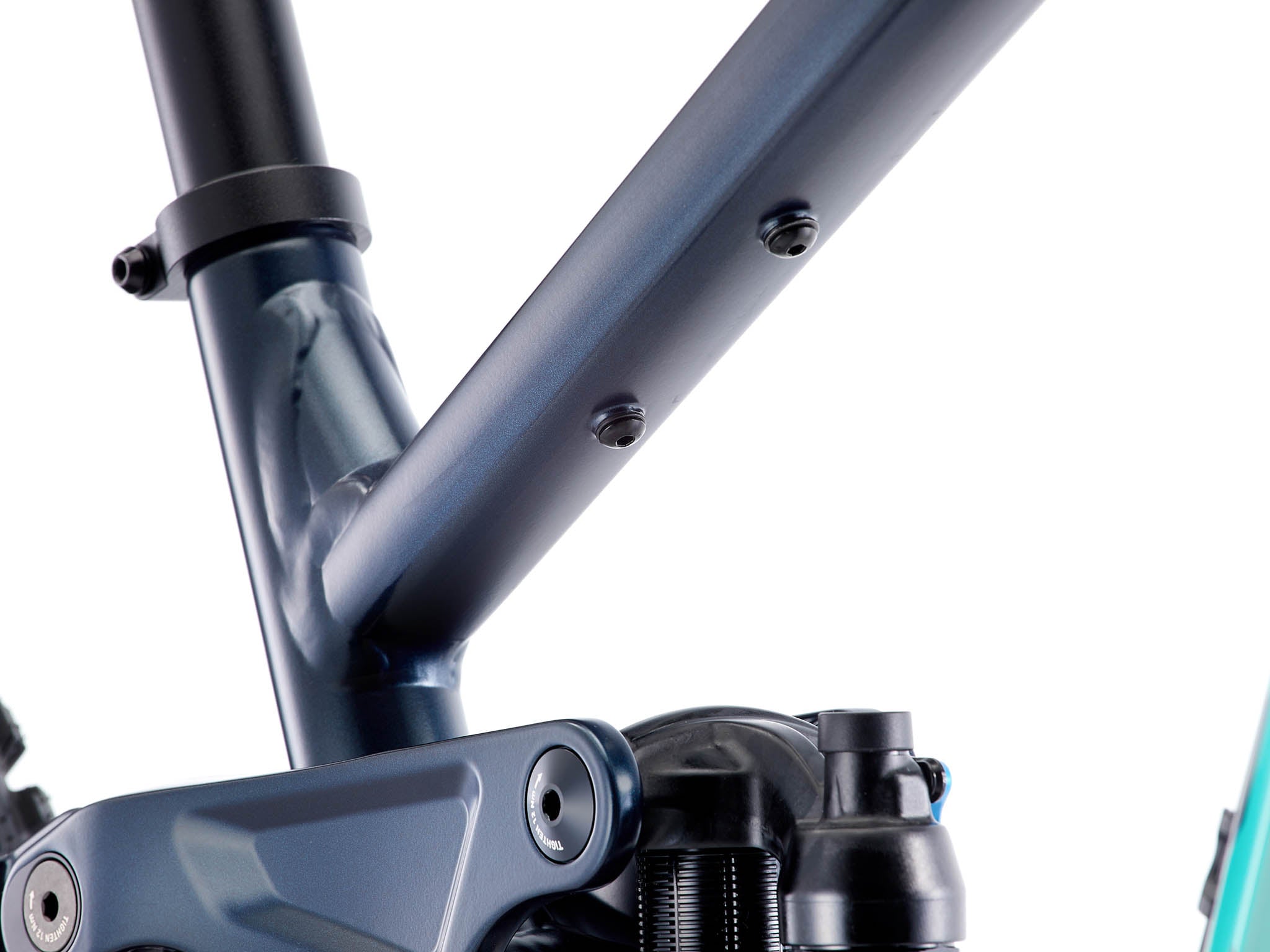 Side view of the Process X aluminum mountain bike in a bike park setting, ready for jumps