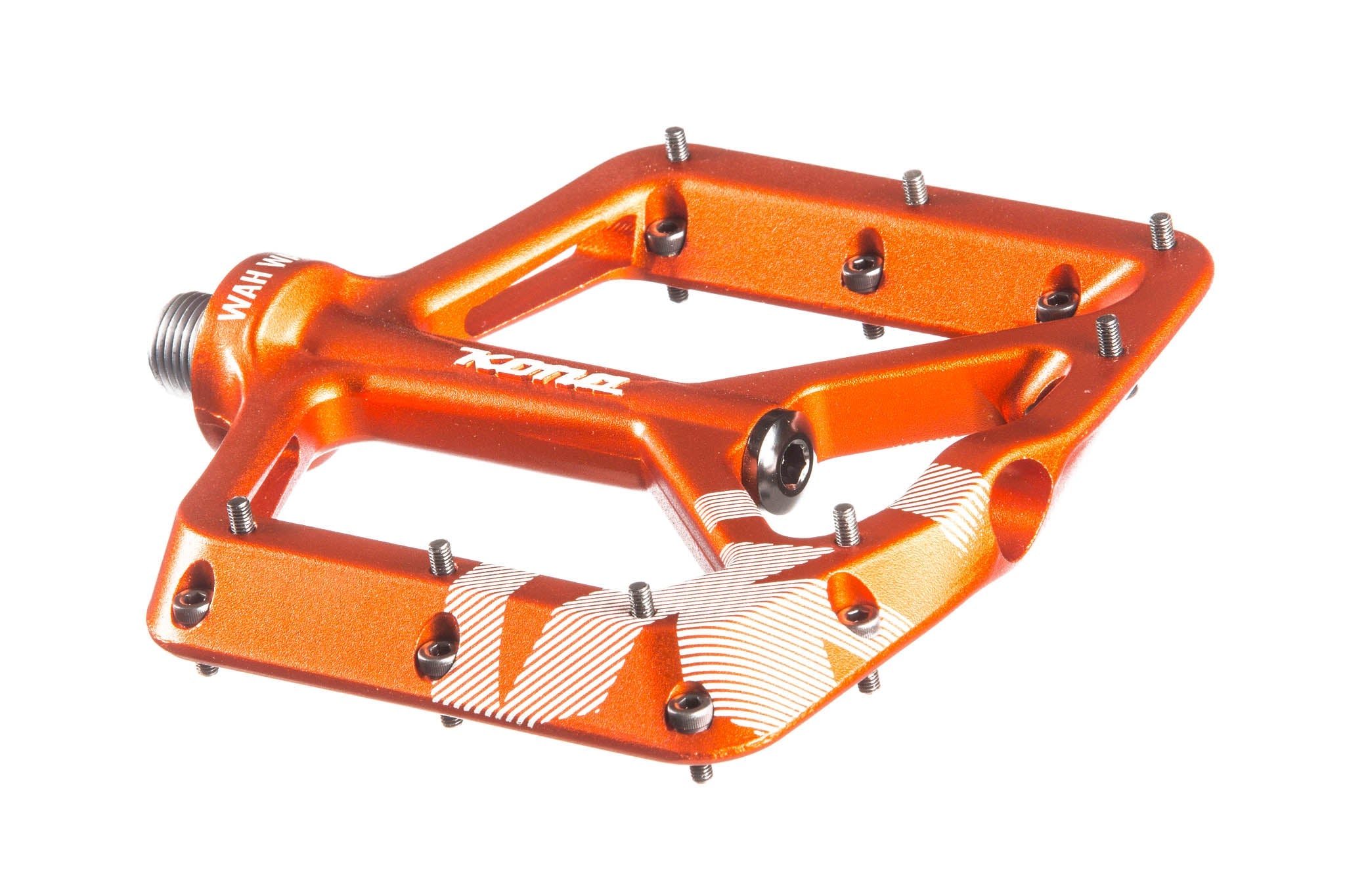 Cyclist using flat pedals for mountain biking on rugged terrain