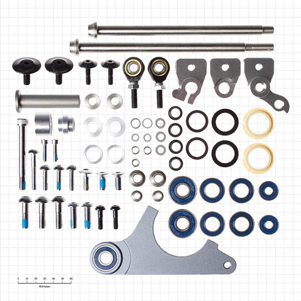 Overhead view of TrailRipper bushing kit showing every sleeve, bolt and o-ring laid out for 2005-2008 Kona downhill models