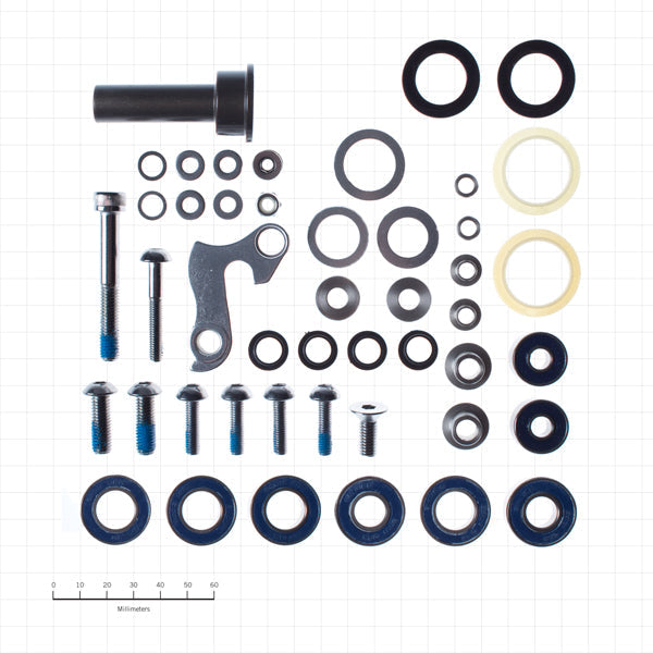 Top-down view of the Stinky Out-of-Bounds bushing kit with each bushing and bolt laid out in order of installation